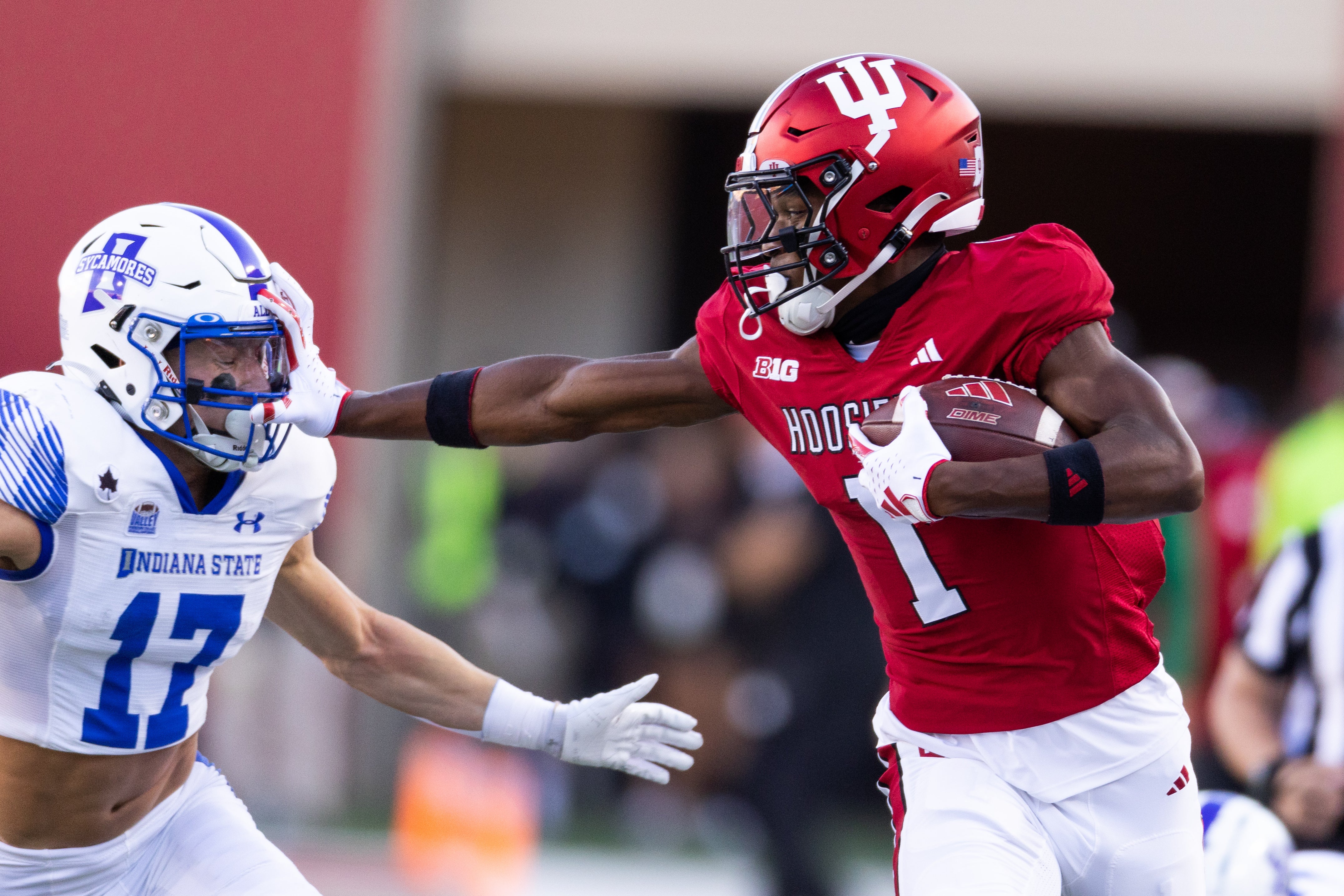 Sep 8, 2023; Bloomington, Indiana, USA; Indiana Hoosiers wide receiver Donaven McCulley (1) runs the ball while Indiana State Sycamores defensive back Maddix Blackwell (17) defends in the first half at Memorial Stadium.