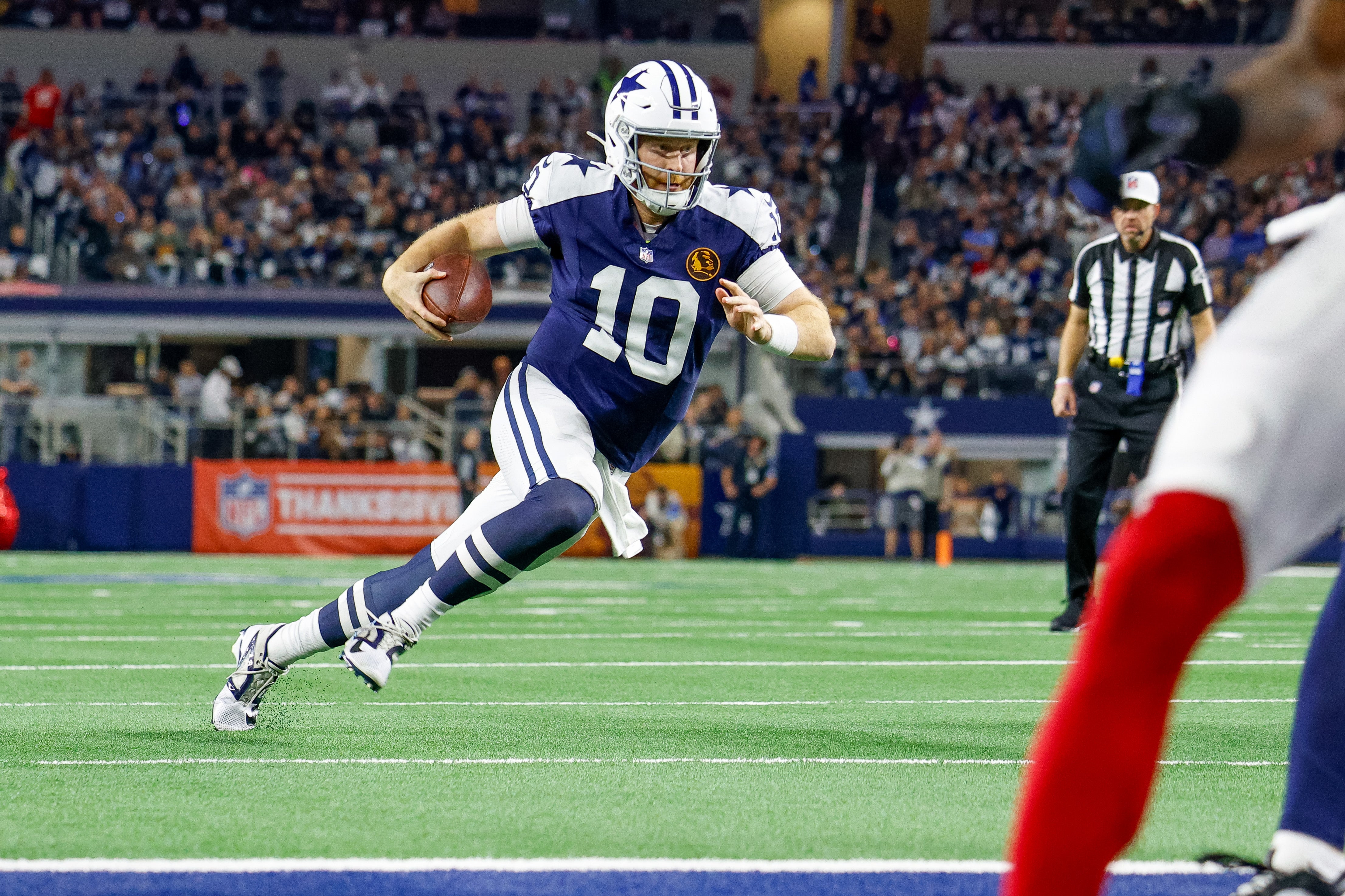 Dallas Cowboys quarterback Cooper Rush (10) runs for the end-zone during the second quarter against the New York Giants at AT&T Stadium.