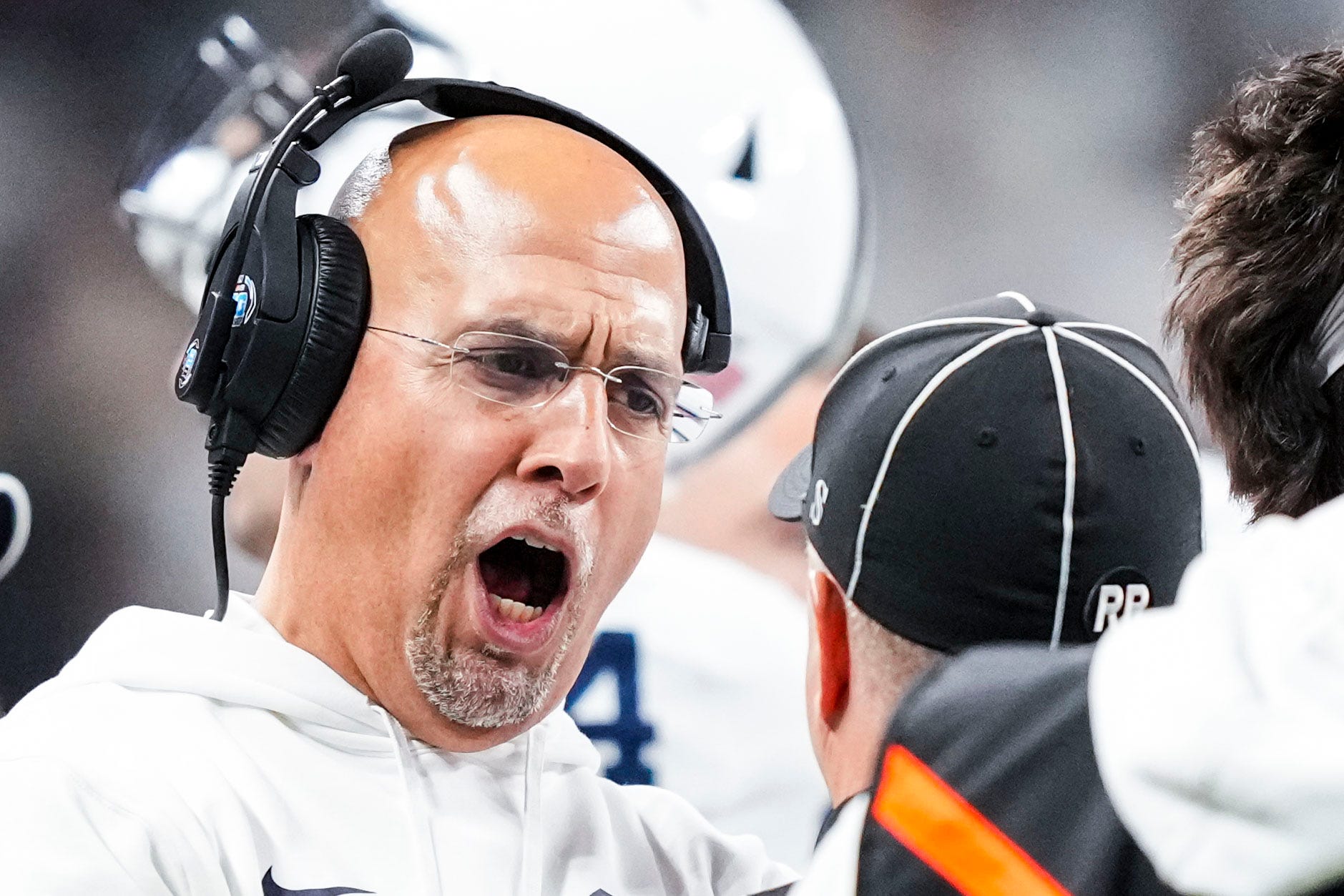 Penn State Nittany Lions head coach James Franklin speaks with an official Saturday, Dec. 7, 2024, during the Big Ten Championship game between the Oregon Ducks and the Penn State Nittany Lions at Lucas Oil Stadium in Indianapolis. The Ducks defeated the Nittany Lions, 45-37.