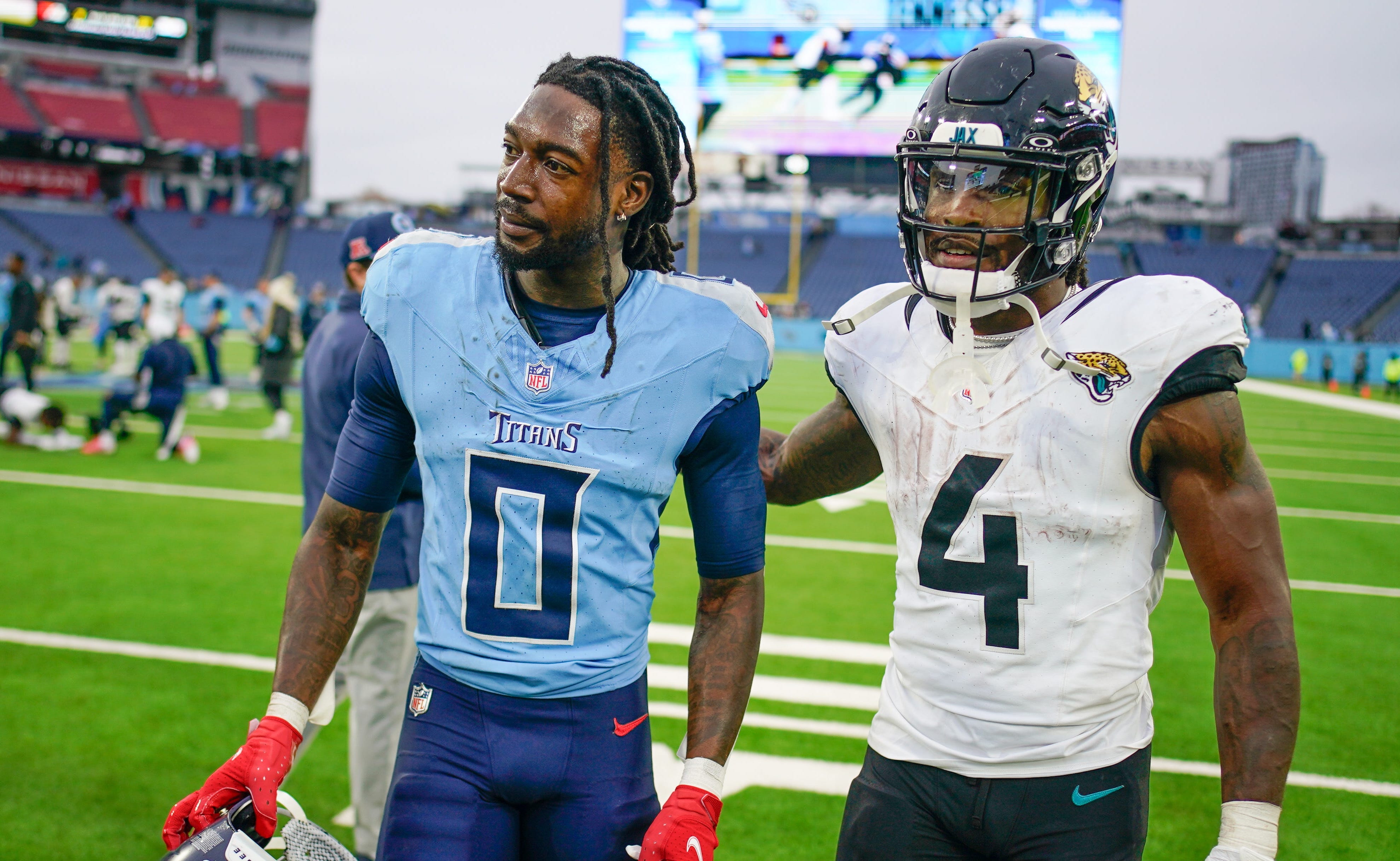 Tennessee Titans wide receiver Calvin Ridley (0) and Jacksonville Jaguars running back Tank Bigsby (4) walk off the field after the game at Nissan Stadium in Nashville, Tenn., Sunday, Dec. 8, 2024 Andrew Nelles / The Tennessean-USA TODAY NETWORK via Imagn Images