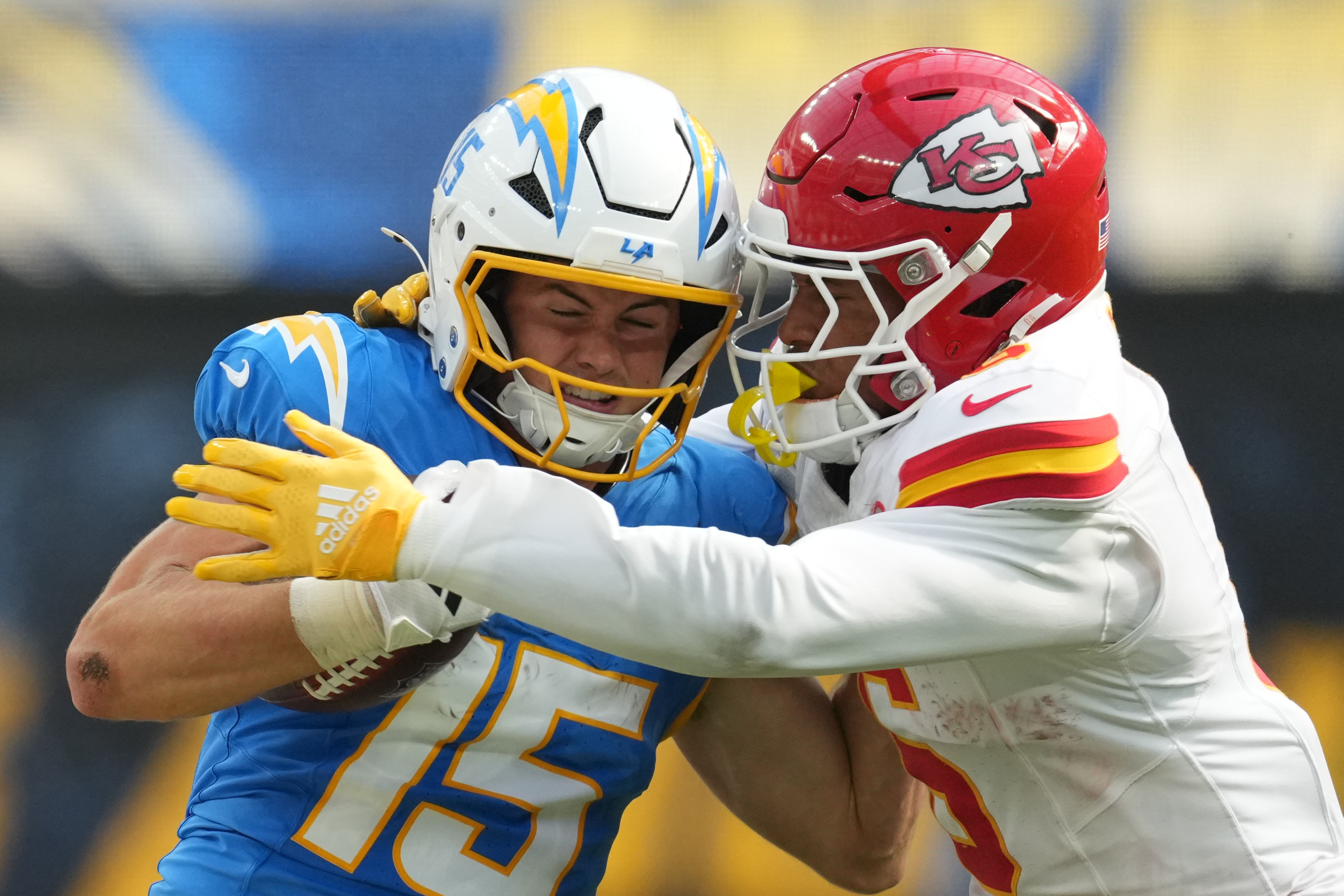 Sep 29, 2024; Inglewood, California, USA; Los Angeles Chargers wide receiver Ladd McConkey (15) carries the ball on a 37-yard reception against Kansas City Chiefs safety Bryan Cook (6 in the second half at SoFi Stadium.