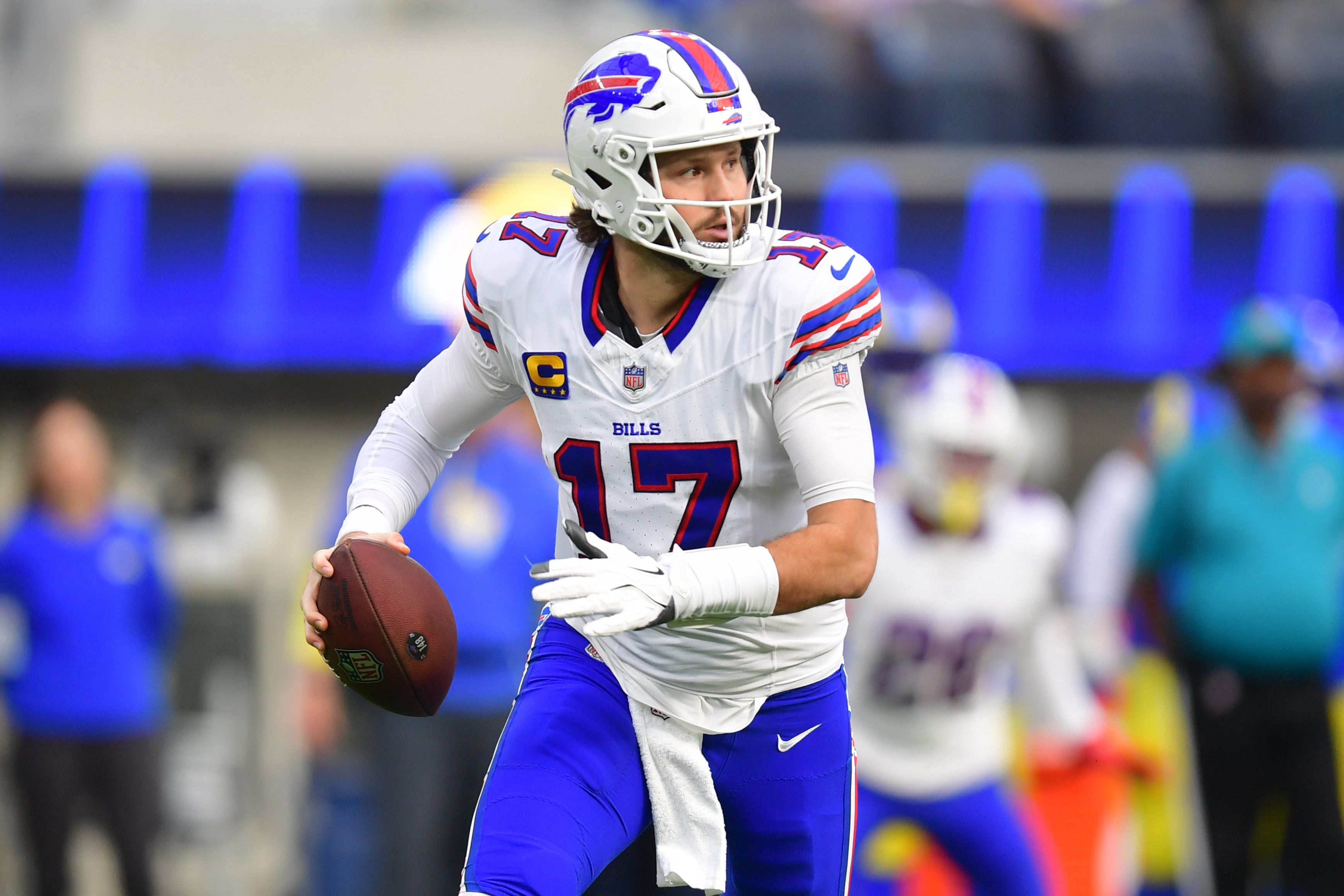 Dec 8, 2024; Inglewood, California, USA; Buffalo Bills quarterback Josh Allen (17) runs the ball against the against the Los Angeles Rams during the first half at SoFi Stadium.