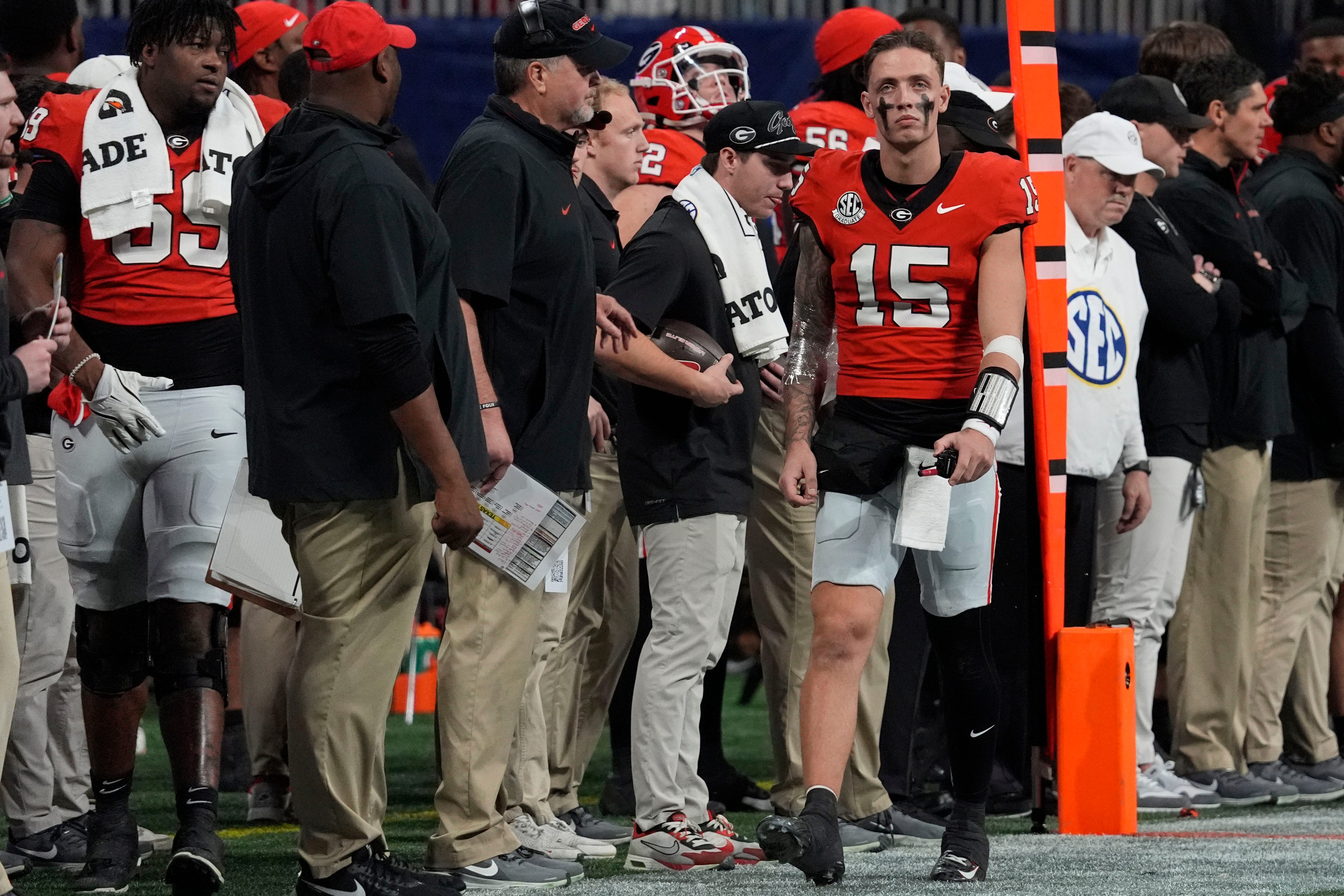 Georgia quarterback Carson Beck (15) on the sideline after leaving the game during the second half of the SEC championship game against Texas in Atlanta, on Saturday, Dec. 7, 2024.