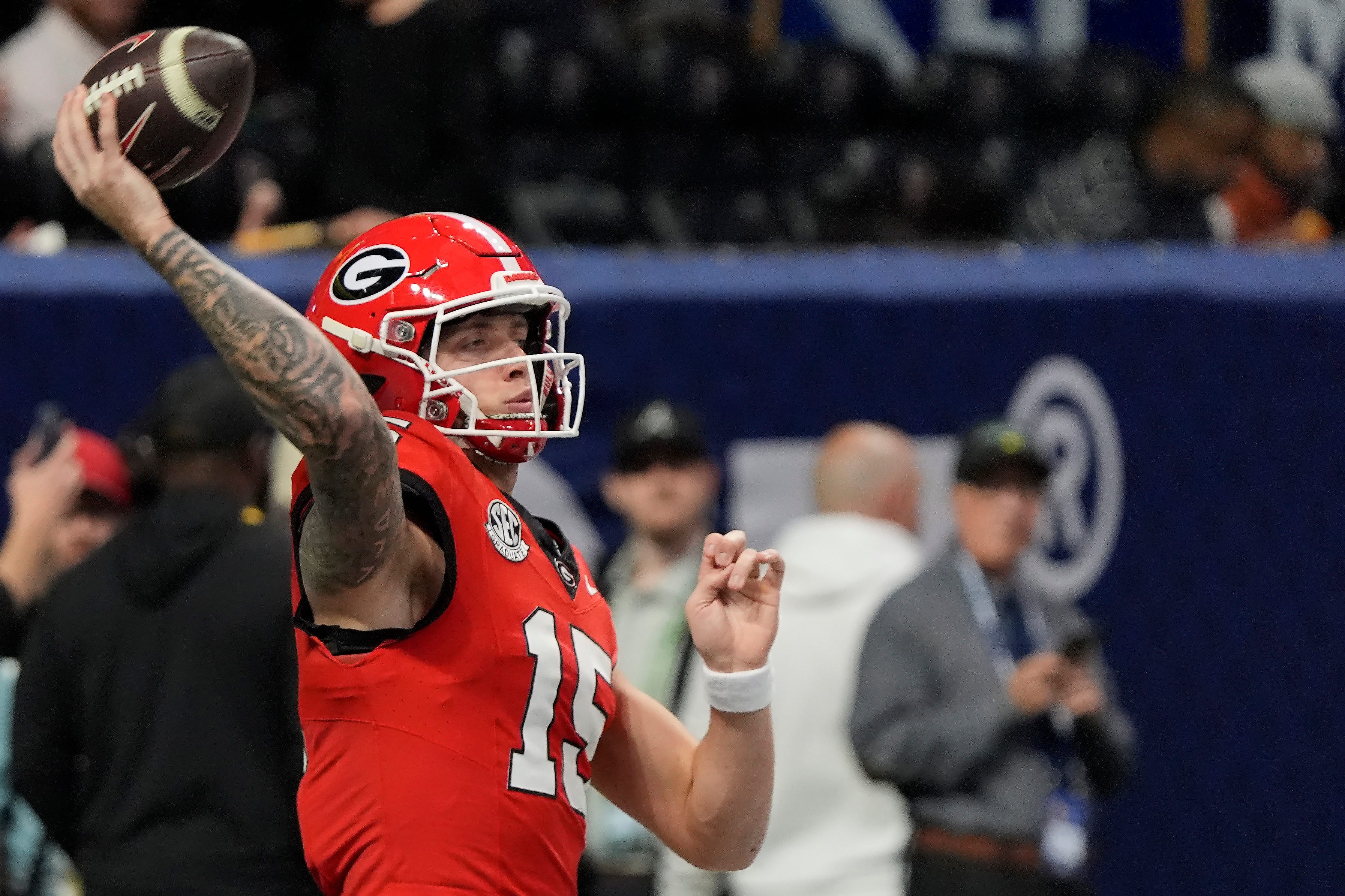 Georgia quarterback Carson Beck (15) warms up before the start of the SEC championship game against Texas in Atlanta, on Saturday, Dec. 7, 2024