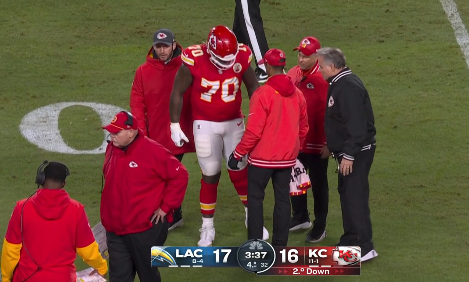Chiefs LT D.J. Humphries helped by trainers after Week 14 injury.