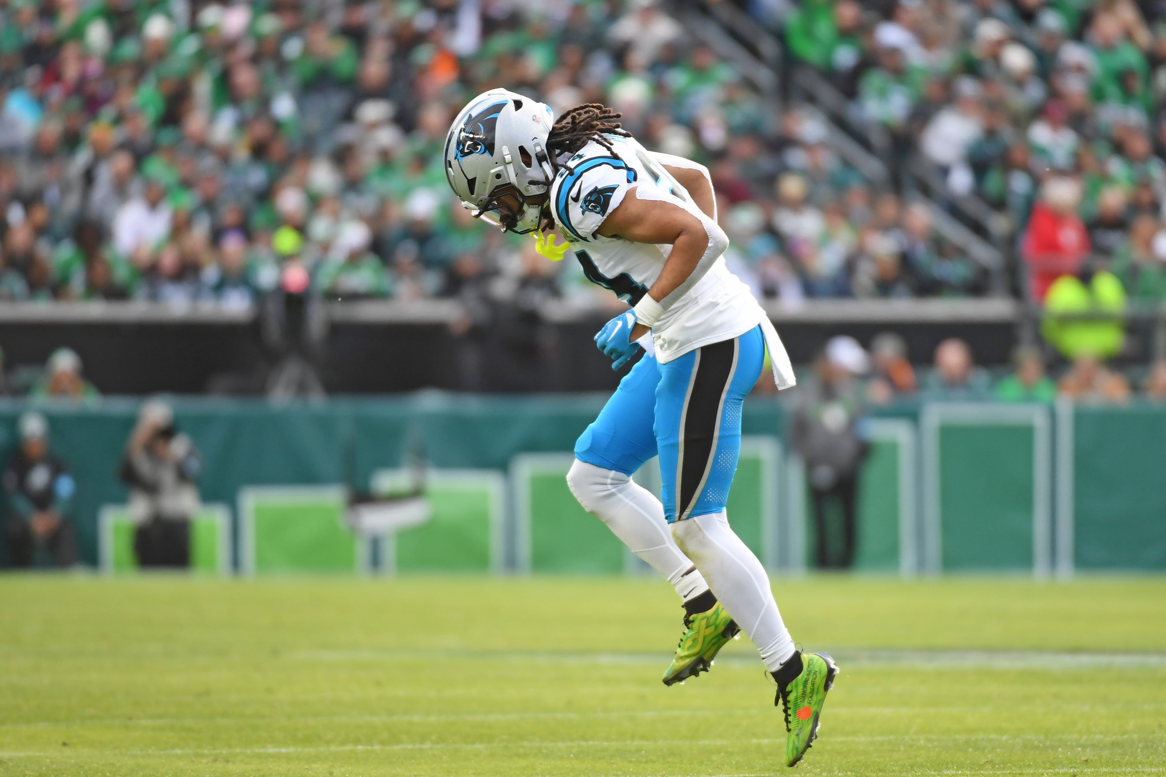 Panthers running back Jonathon Brooks (24) tries to get off the field after being injured against the Eagles.