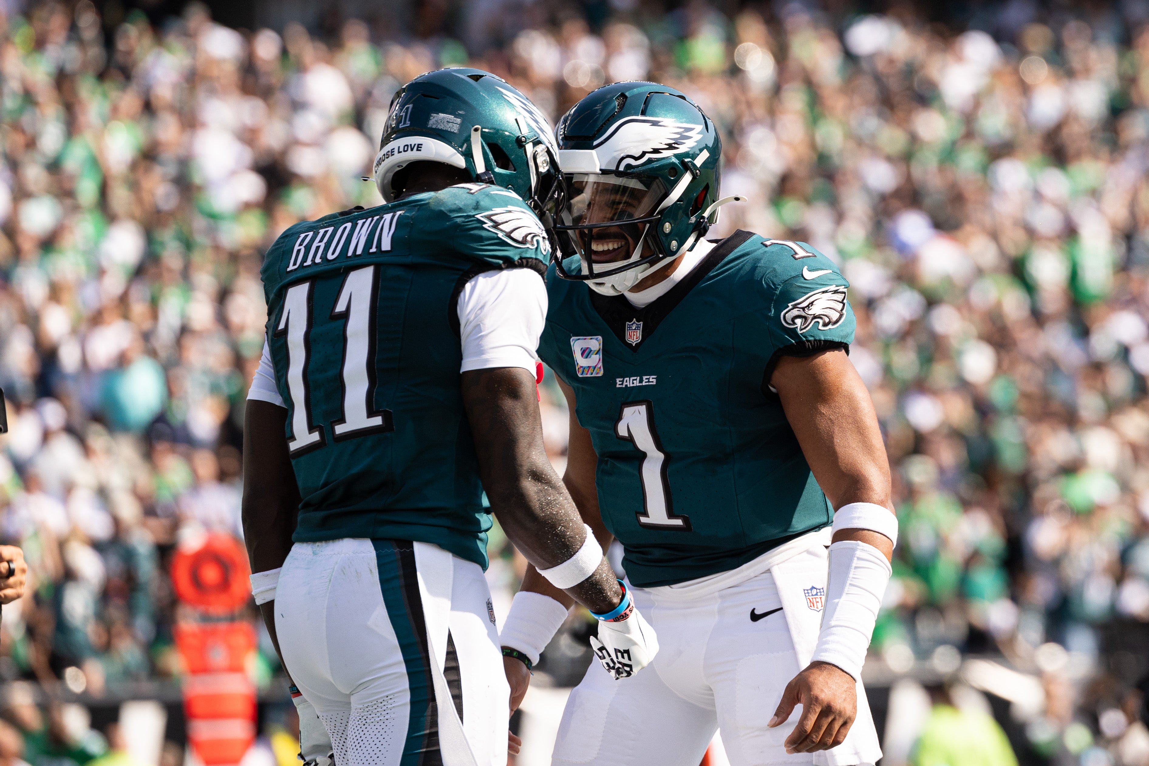 Oct 13, 2024; Philadelphia, Pennsylvania, USA; Philadelphia Eagles quarterback Jalen Hurts (1) and wide receiver A.J. Brown (11) celebrate their touchdown pass during the second quarter against the Cleveland Browns at Lincoln Financial Field.