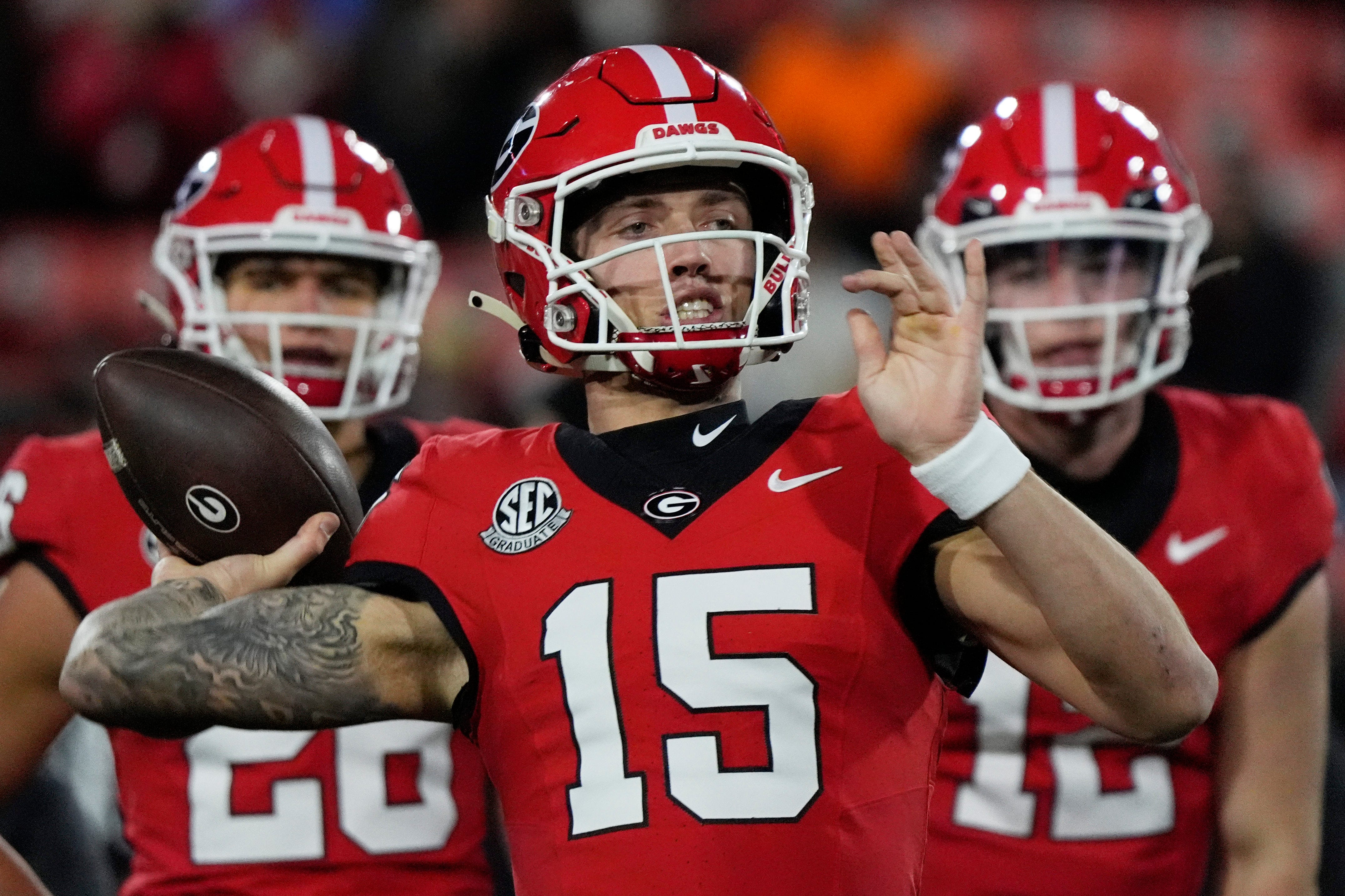 Georgia quarterback Carson Beck (15) warms up before the start of a NCAA college football game against Georgia Tech in Athens, Ga., on Friday, Nov. 29, 2024