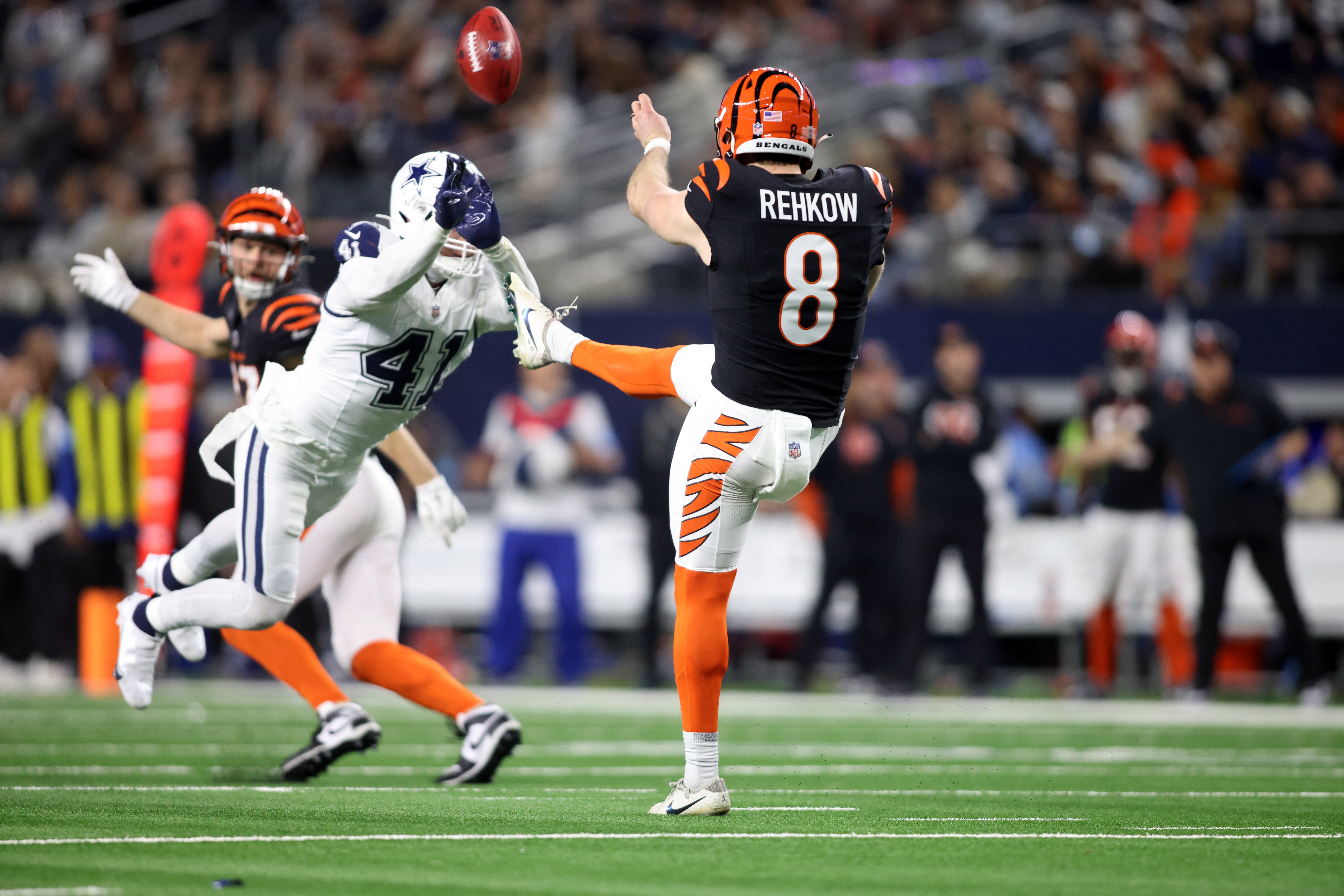 Dec 9, 2024; Arlington, Texas, USA; Dallas Cowboys linebacker Nick Vigil (41) blocks a punt by Cincinnati Bengals punter Ryan Rehkow (8) in the fourth quarter at AT&T Stadium.