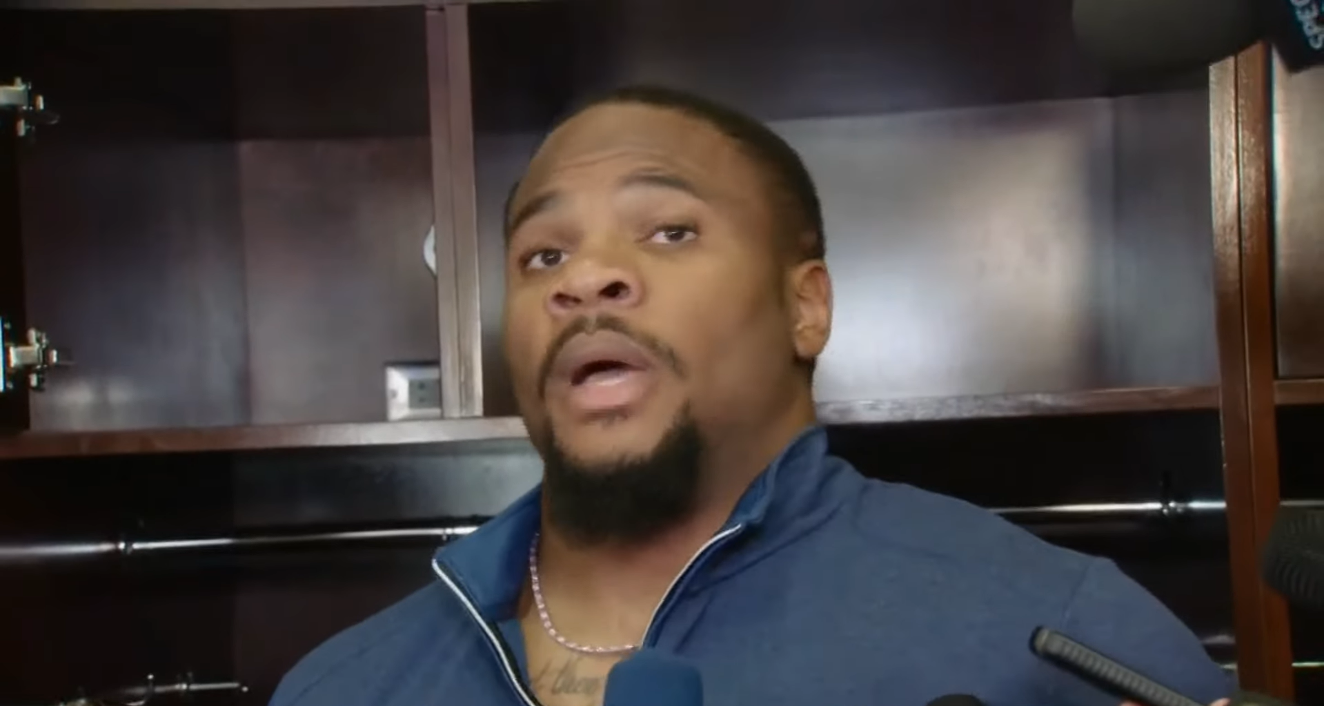 Dallas Cowboys DE Micah Parsons talks to reporters postgame.