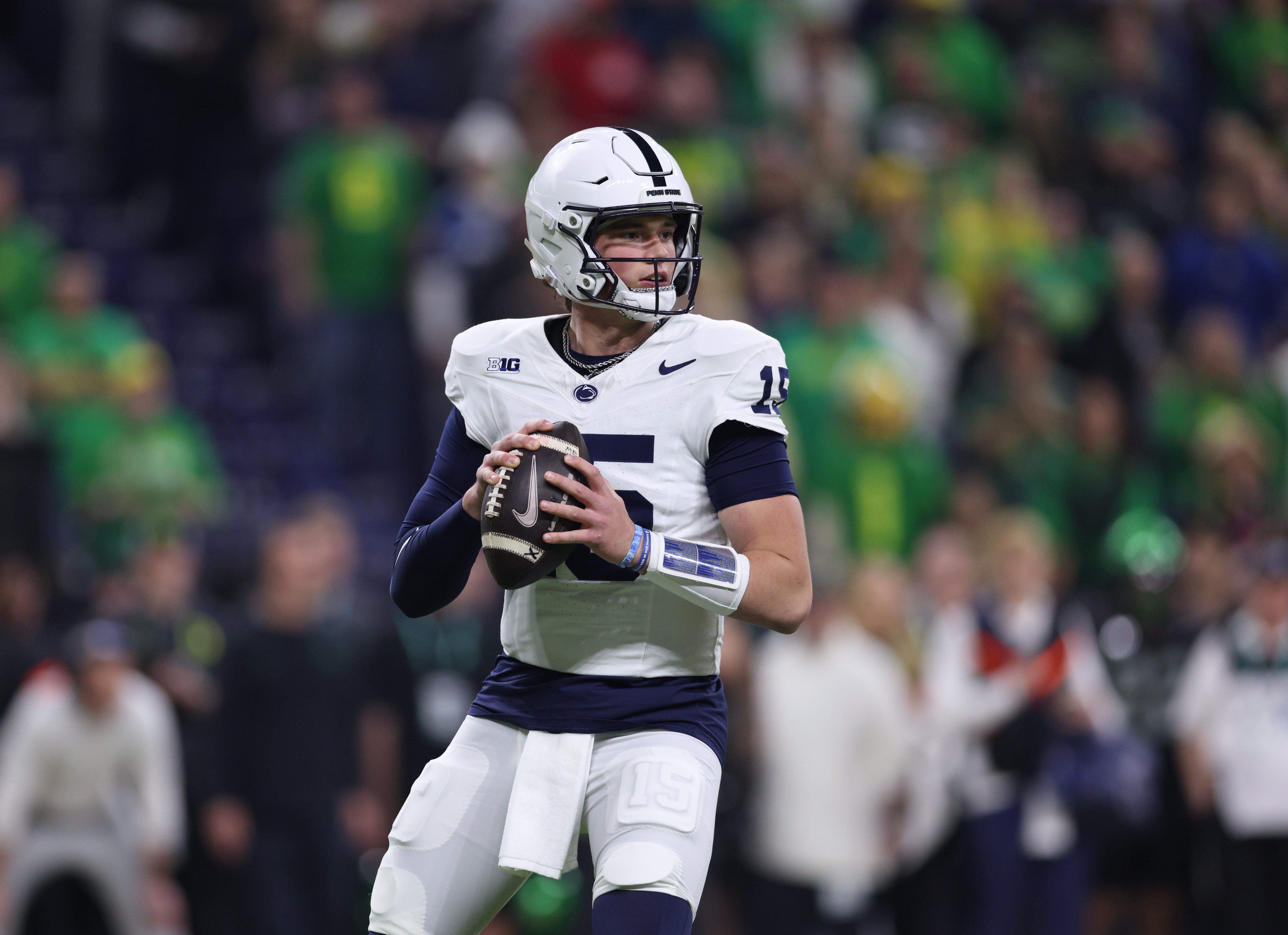 Dec 7, 2024; Indianapolis, IN, USA; Penn State Nittany Lions quarterback Drew Allar (15) looks downfield during the first quarter against the Oregon Ducks in the 2024 Big Ten Championship game at Lucas Oil Stadium.