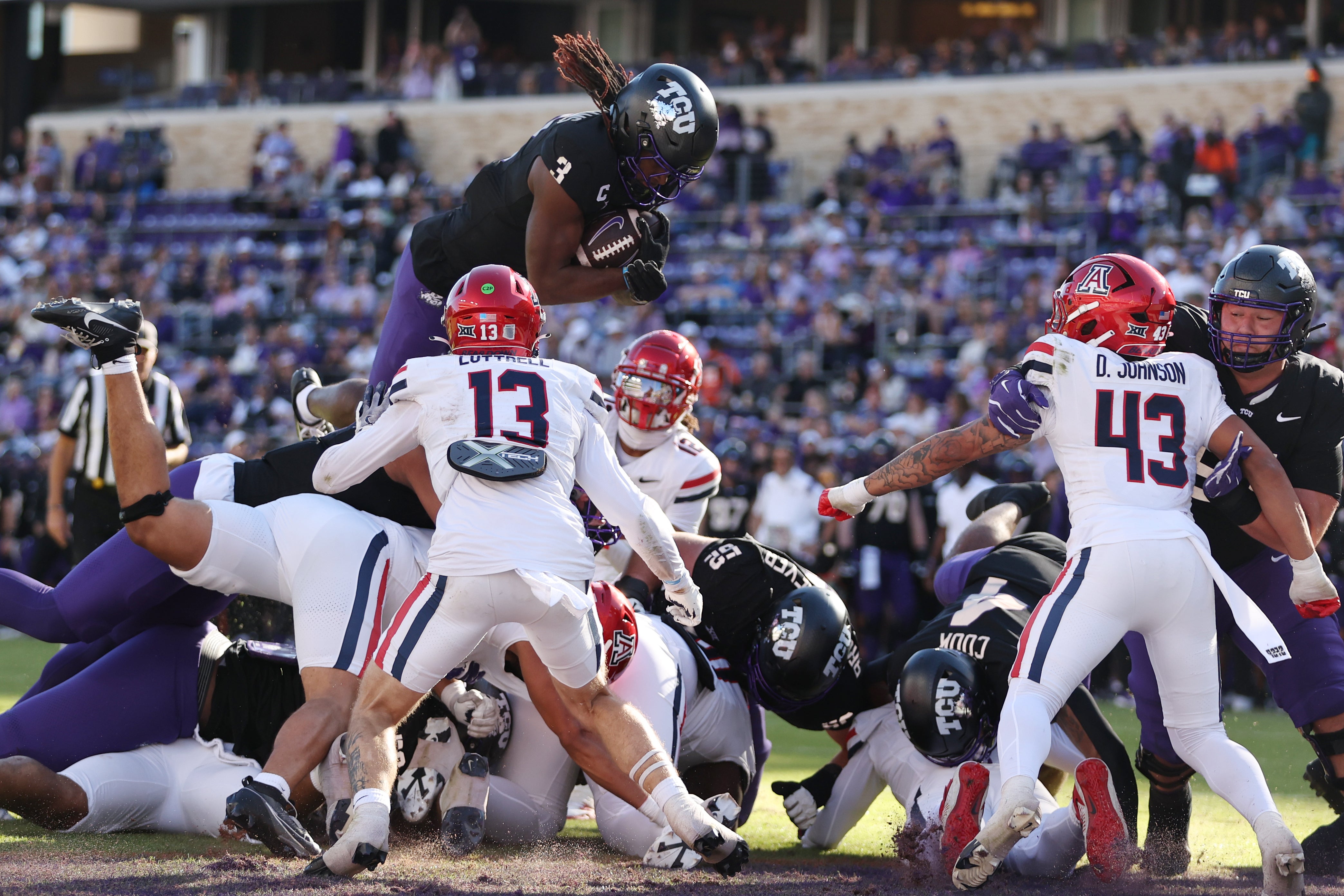 TCU Horned Frogs wide receiver Savion Williams (3) scores a touchdown against the Arizona Wildcats in the first quarter at Amon G. Carter Stadium. 