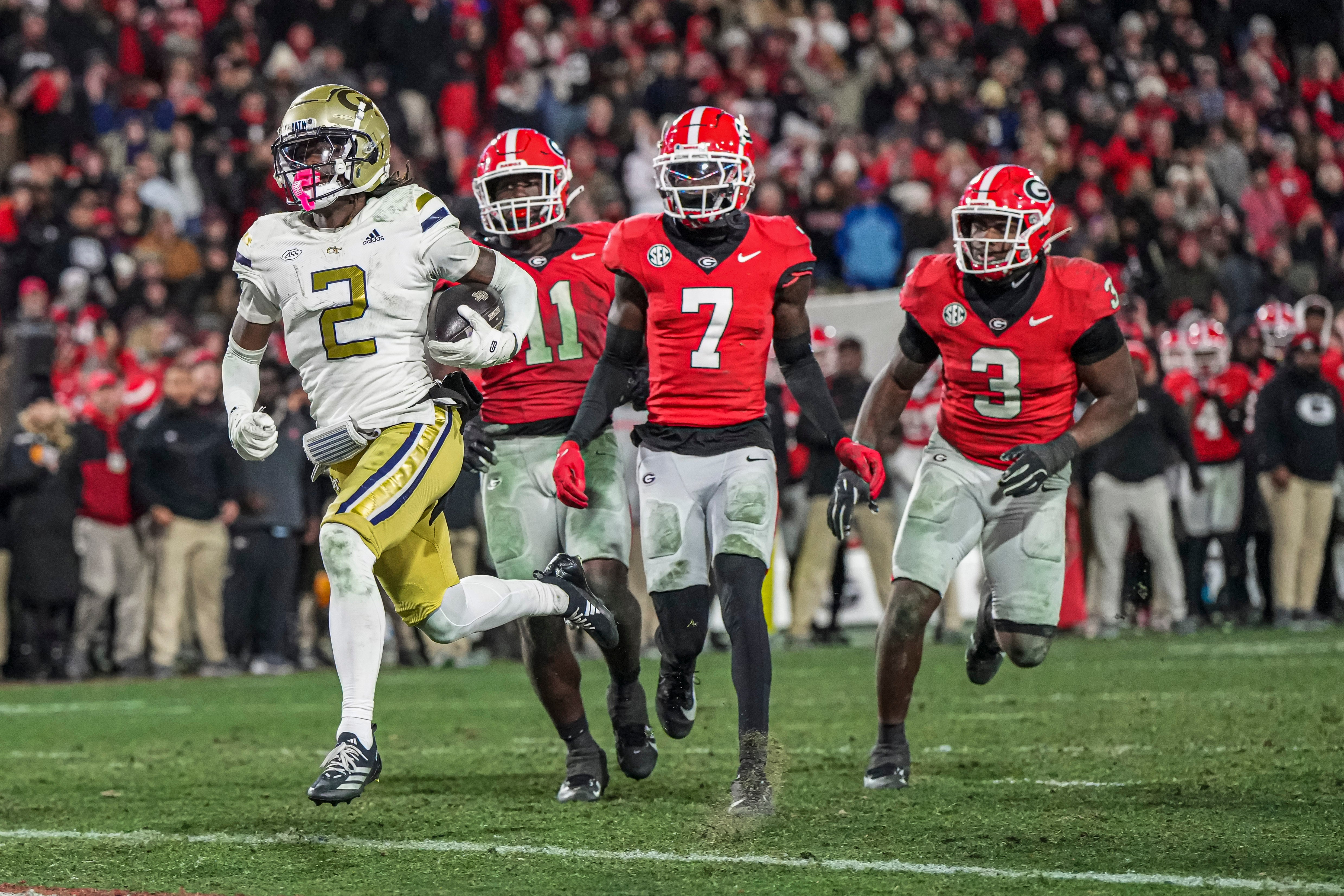 Georgia Tech Yellow Jackets wide receiver Eric Singleton Jr. (2) scores a touchdown against the Georgia Bulldogs during overtime at Sanford Stadium.