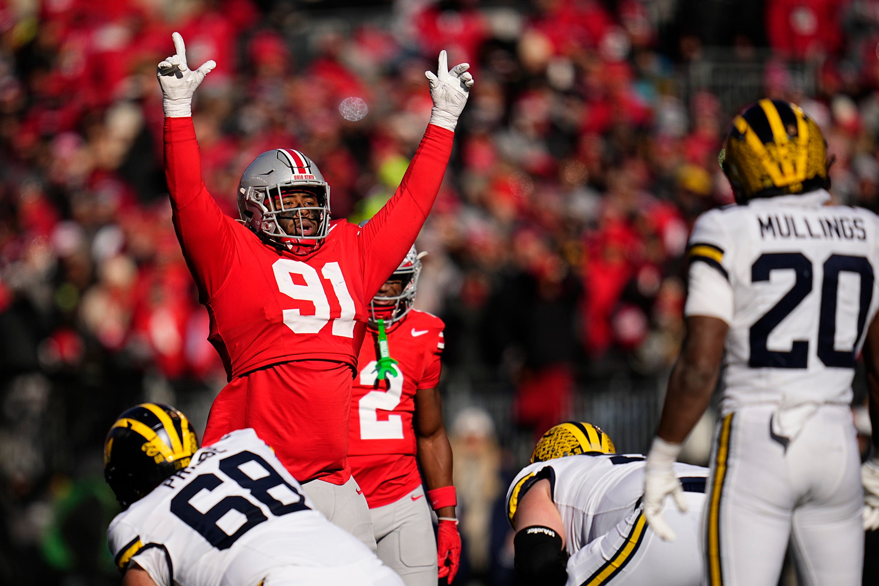 Ohio State Buckeyes defensive tackle Tyleik Williams (91) motions at the line during the first half of the NCAA football game against the Michigan Wolverines at Ohio Stadium in Columbus on Saturday, Nov. 30, 2024.
