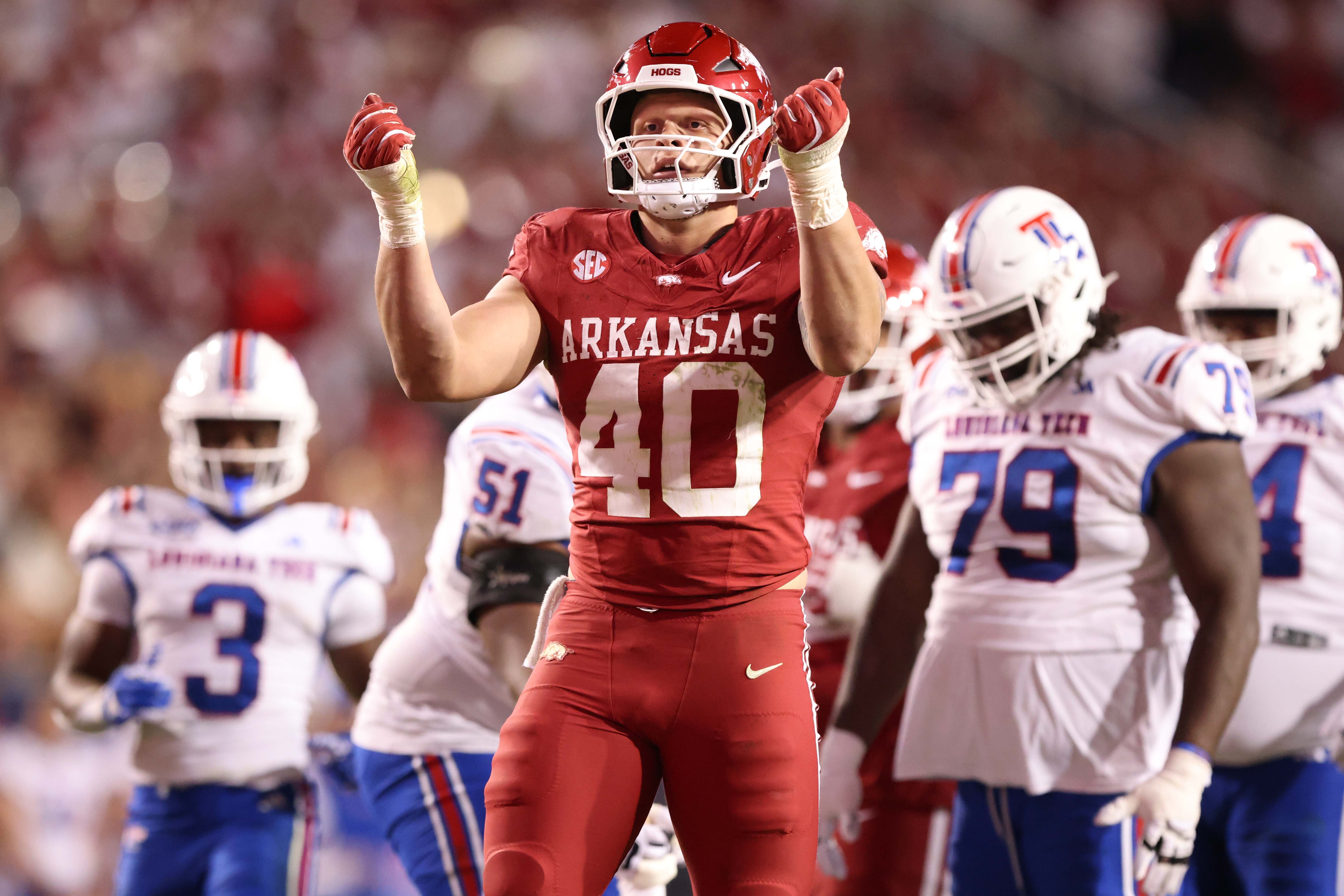 Arkansas Razorbacks defensive lineman Landon Jackson (40) celebrates after sacking Louisiana Tech Bulldogs quarterback Evan Bullock (7) during the fourth quarter at Donald W. Reynolds Razorback Stadium. Arkansas won 35-14.