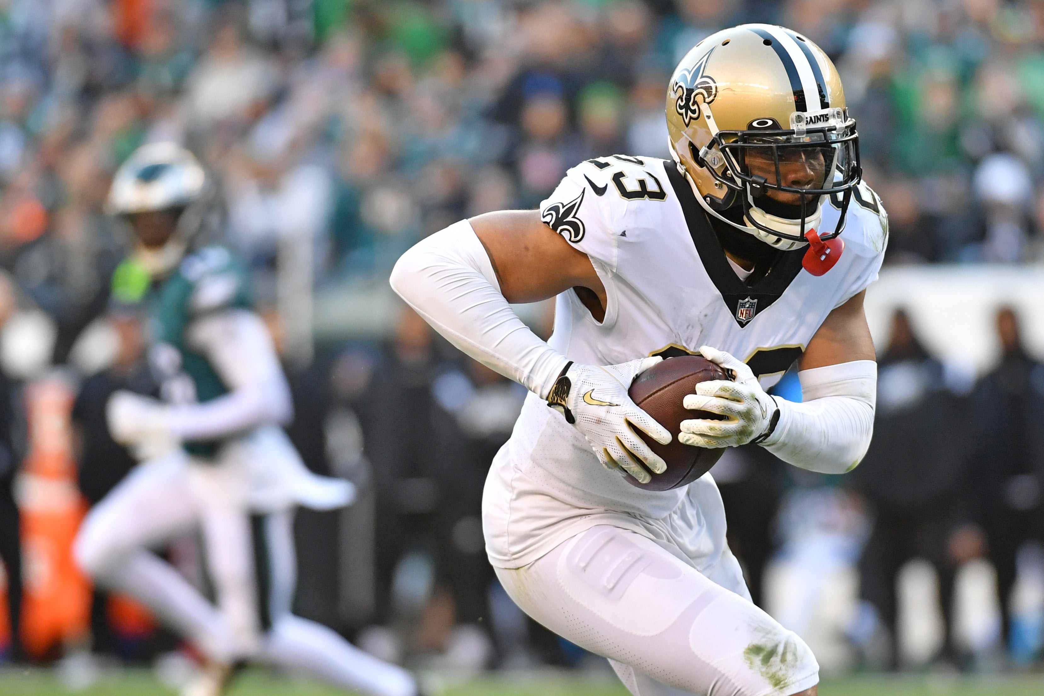 Jan 1, 2023; Philadelphia, Pennsylvania, USA; New Orleans Saints cornerback Marshon Lattimore (23) runs with the football after intercepting a pass against the Philadelphia Eagles at Lincoln Financial Field.