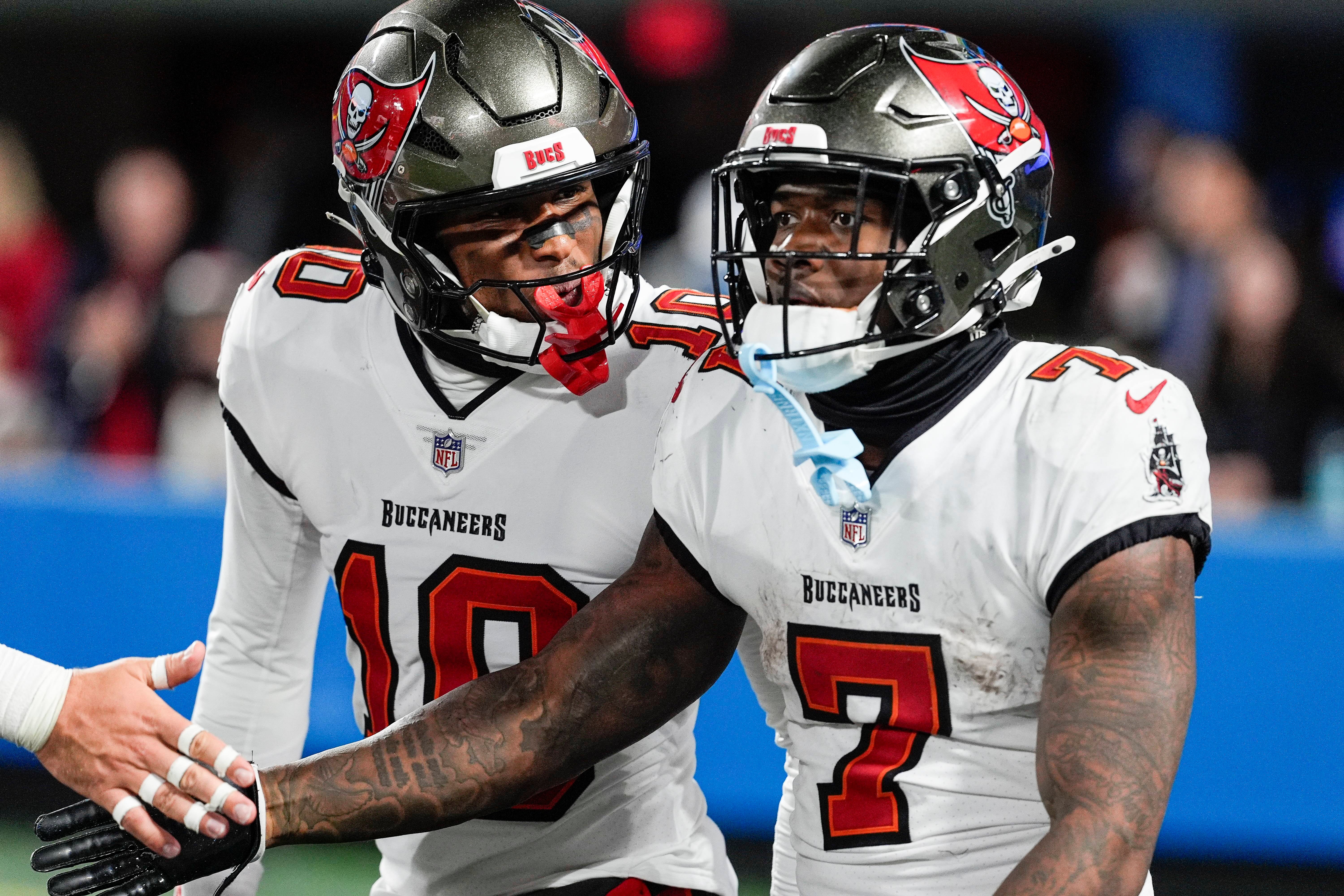 Dec 1, 2024; Charlotte, North Carolina, USA; Tampa Bay Buccaneers wide receiver Trey Palmer (10) celebrates a run by running back Bucky Irving (7) during the second half against the Carolina Panthers at Bank of America Stadium.