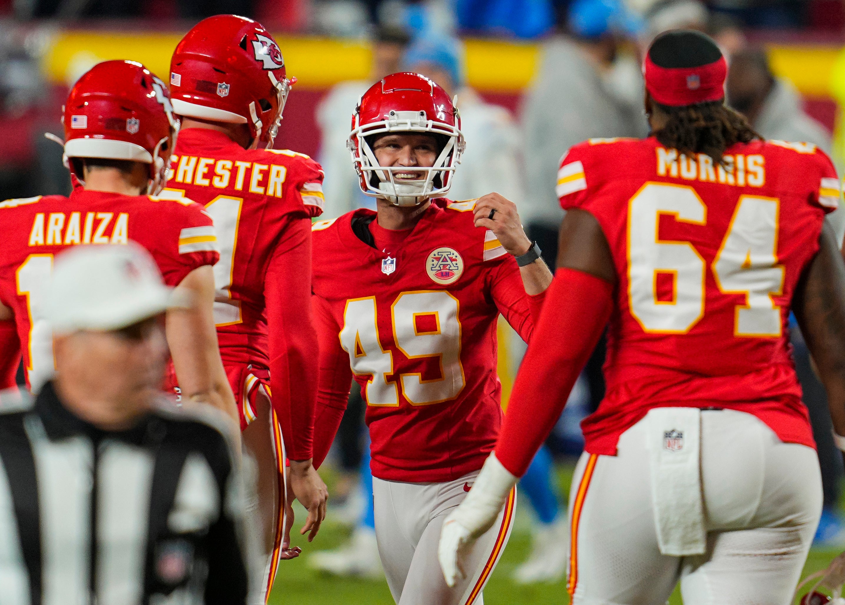 Dec 8, 2024; Kansas City, Missouri, USA; Kansas City Chiefs place kicker Matthew Wright (49) celebrates after kicking a game winning field goal as time expires against the Los Angeles Chargers at GEHA Field at Arrowhead Stadium.