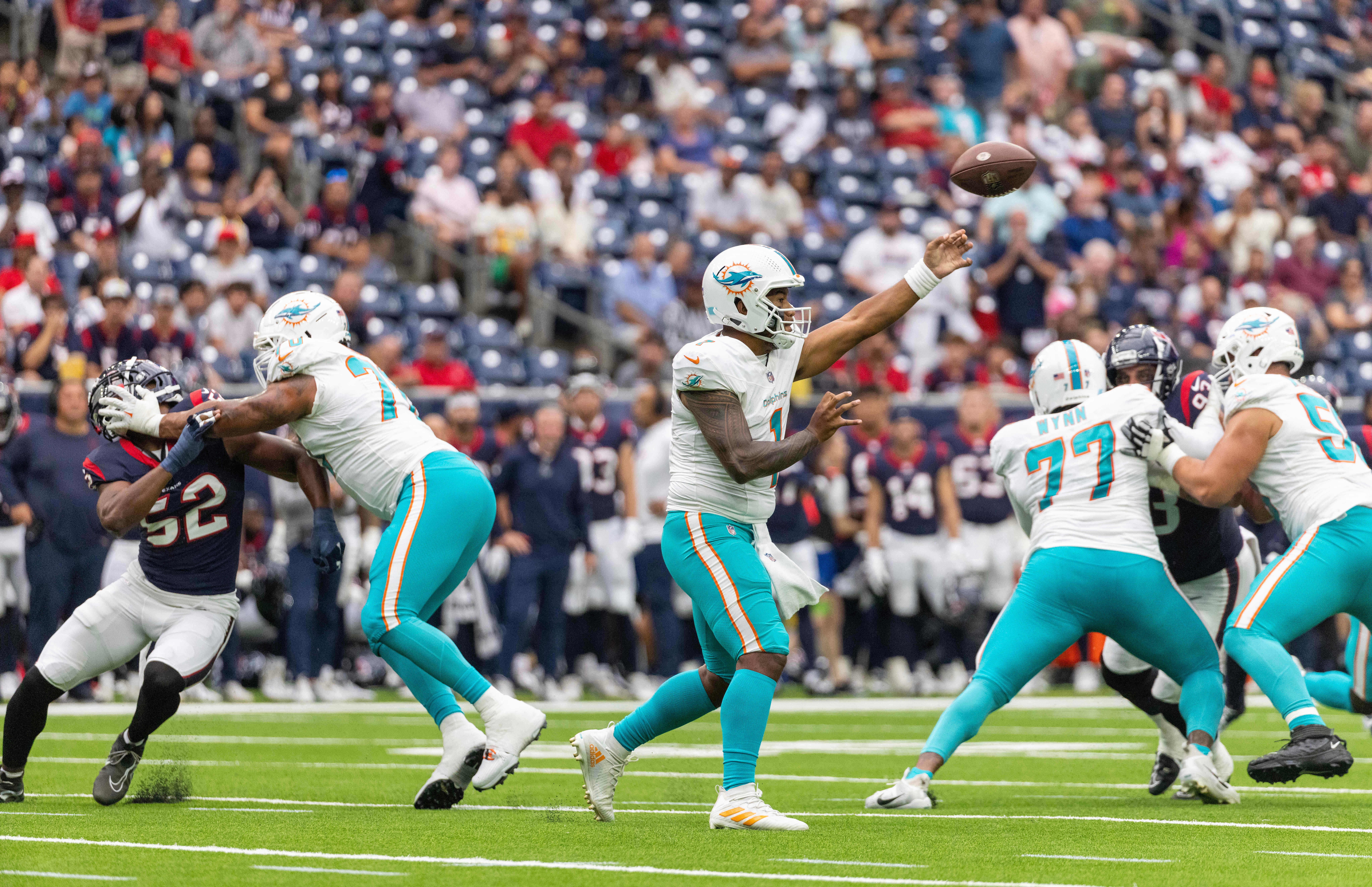 Aug 19, 2023; Houston, Texas, USA; Miami Dolphins quarterback Tua Tagovailoa (1) passes against the Houston Texans in the first quarter at NRG Stadium.