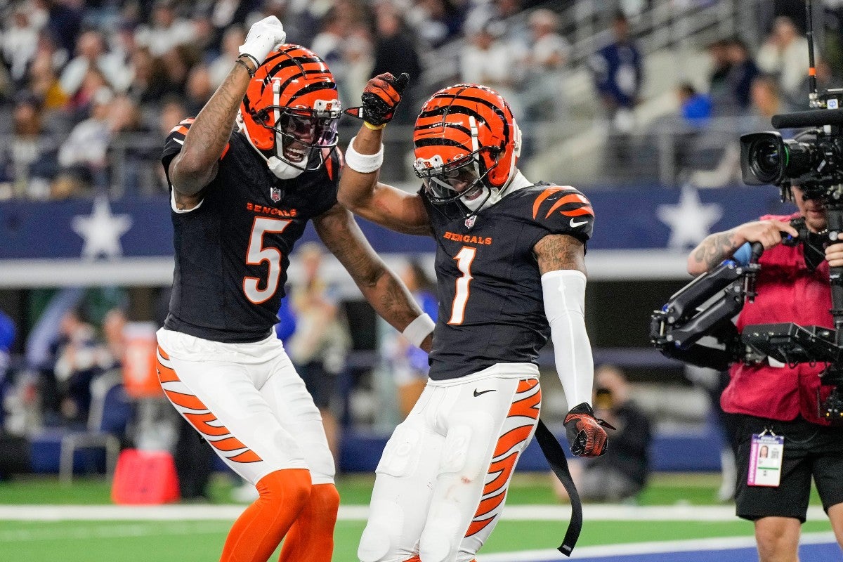 Cincinnati Bengals wide receiver Tee Higgins (5) and wide receiver Ja'Marr Chase (1) dance after Chase scored a touchdown in the 4th quarter to beat the Dallas Cowboys in Monday Night Football at AT&T Stadium in Arlington, Texas on Monday, December 9, 2024.  