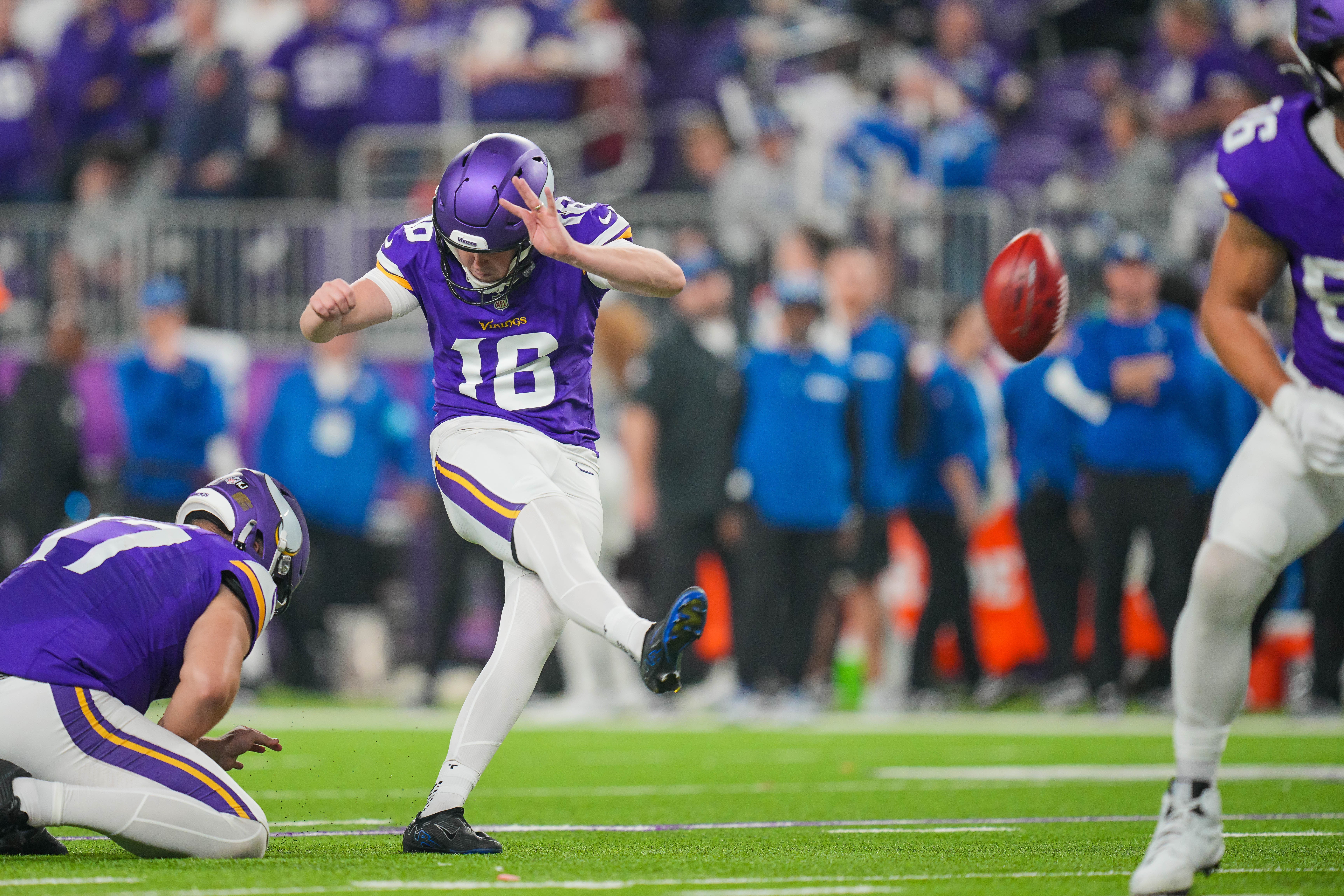 Nov 3, 2024; Minneapolis, Minnesota, USA; Minnesota Vikings place kicker Will Reichard (16) kicks an extra point against the Indianapolis Colts in the fourth quarter at U.S. Bank Stadium.