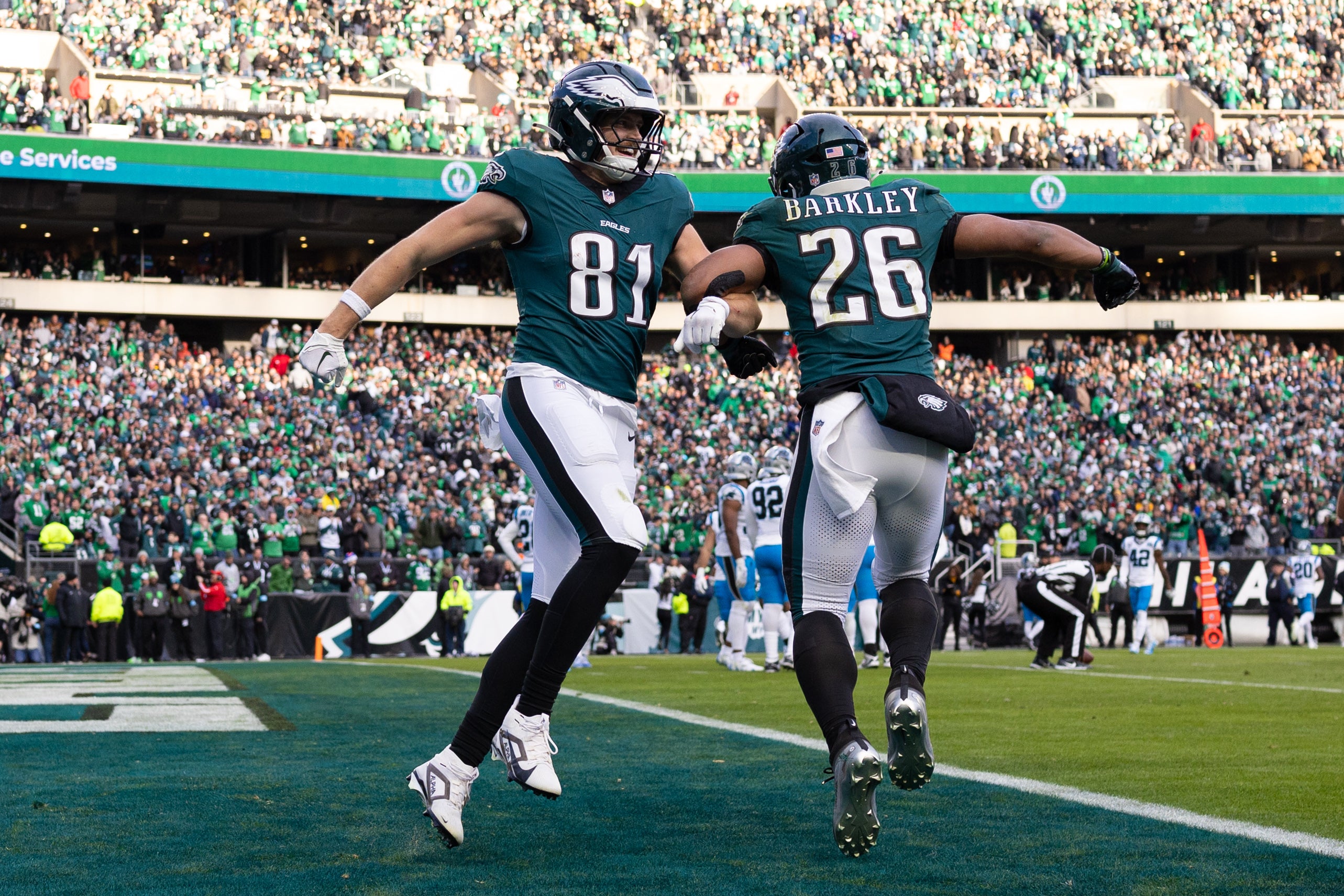 Eagles tight end Grant Calcaterra (81) celebrates his touchdown with running back Saquon Barkley (26) during the third quarter against the Panthers.