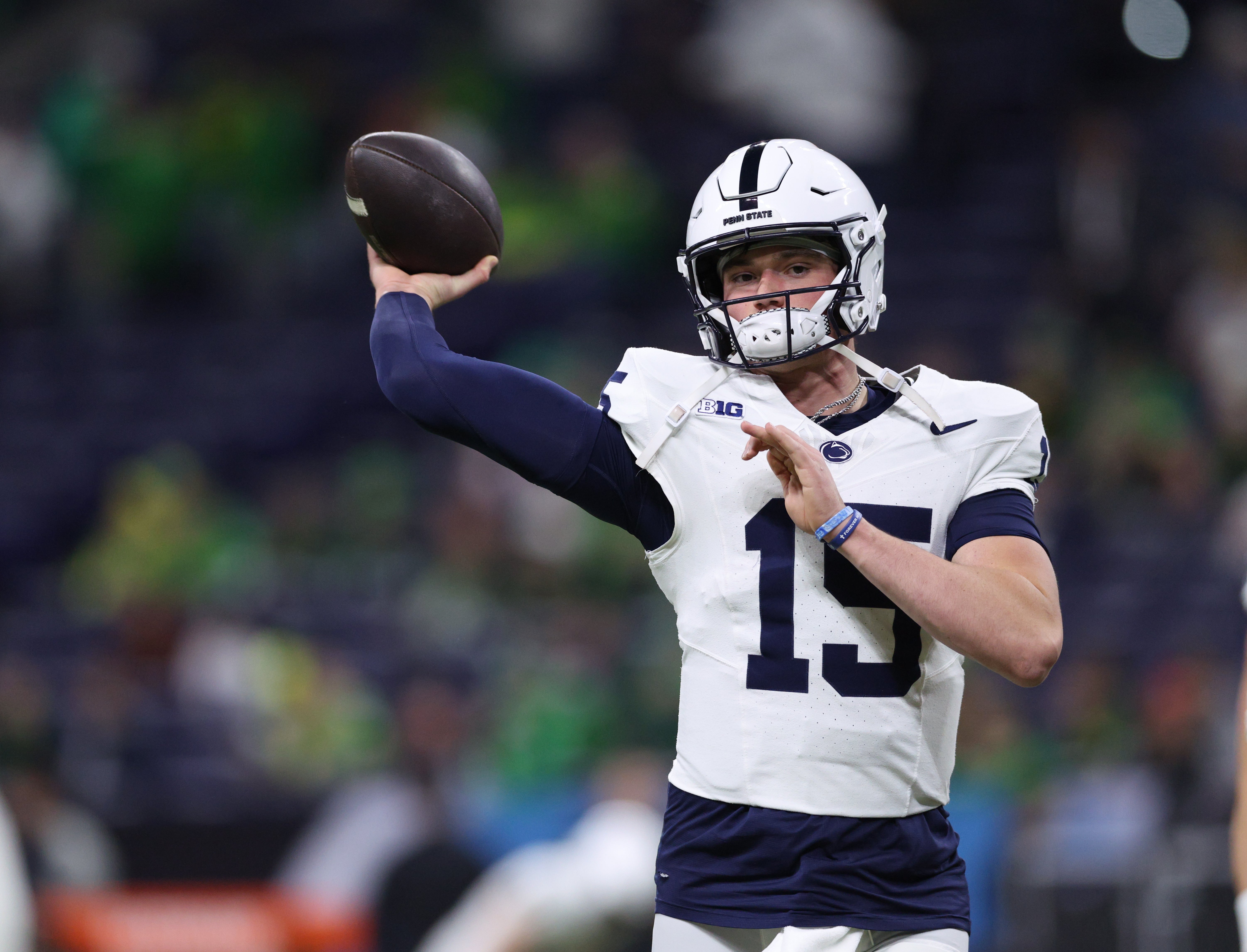 Dec 7, 2024; Indianapolis, IN, USA; Penn State Nittany Lions quarterback Drew Allar (15) warms up before a game against the Oregon Ducks in the 2024 Big Ten Championship game at Lucas Oil Stadium.