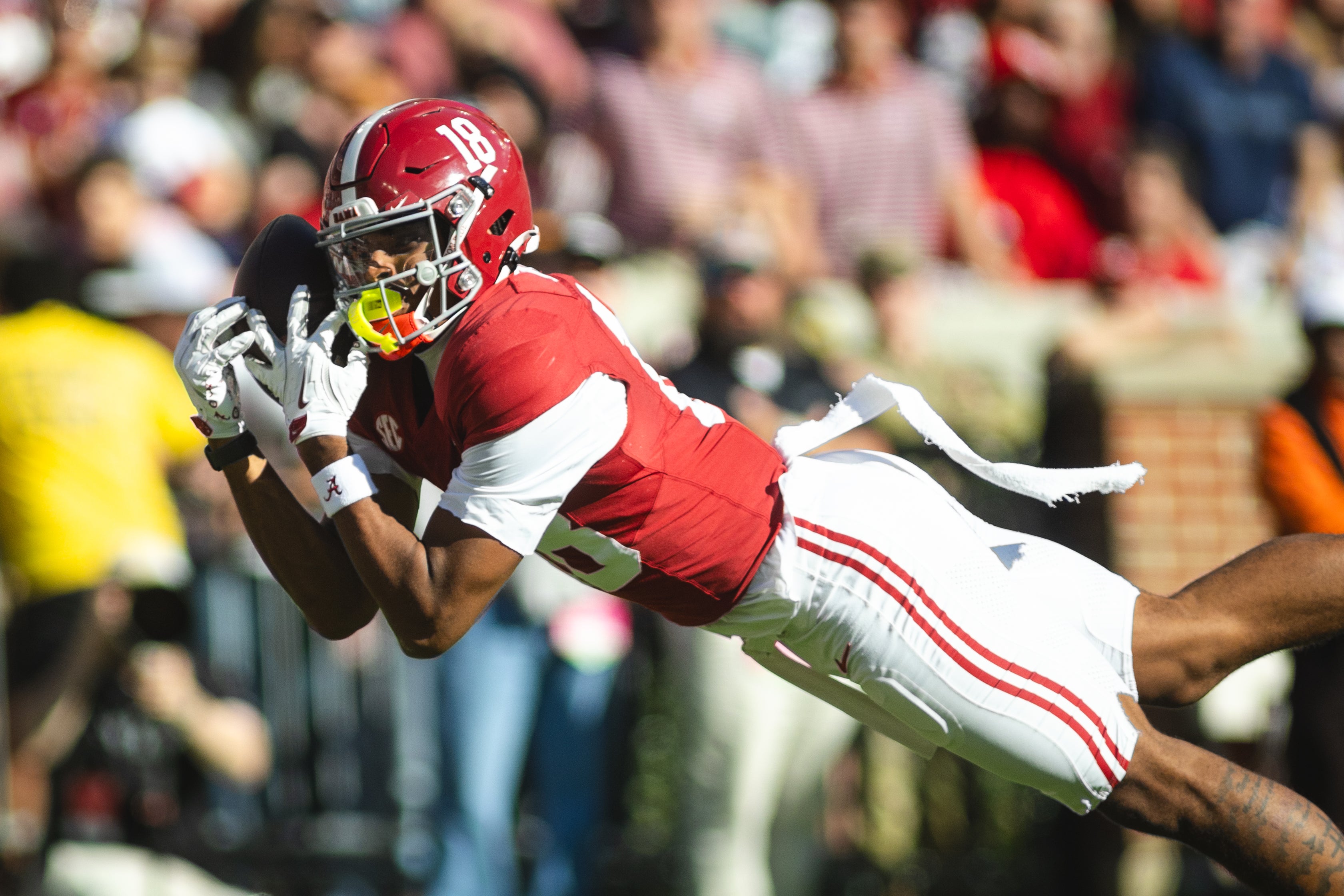 Nov 16, 2024; Tuscaloosa, Alabama, USA; Alabama Crimson Tide wide receiver Caleb Odom (18) dives in an attempt to complete a pass agains the Mercer Bears during the first quarter at Bryant-Denny Stadium.