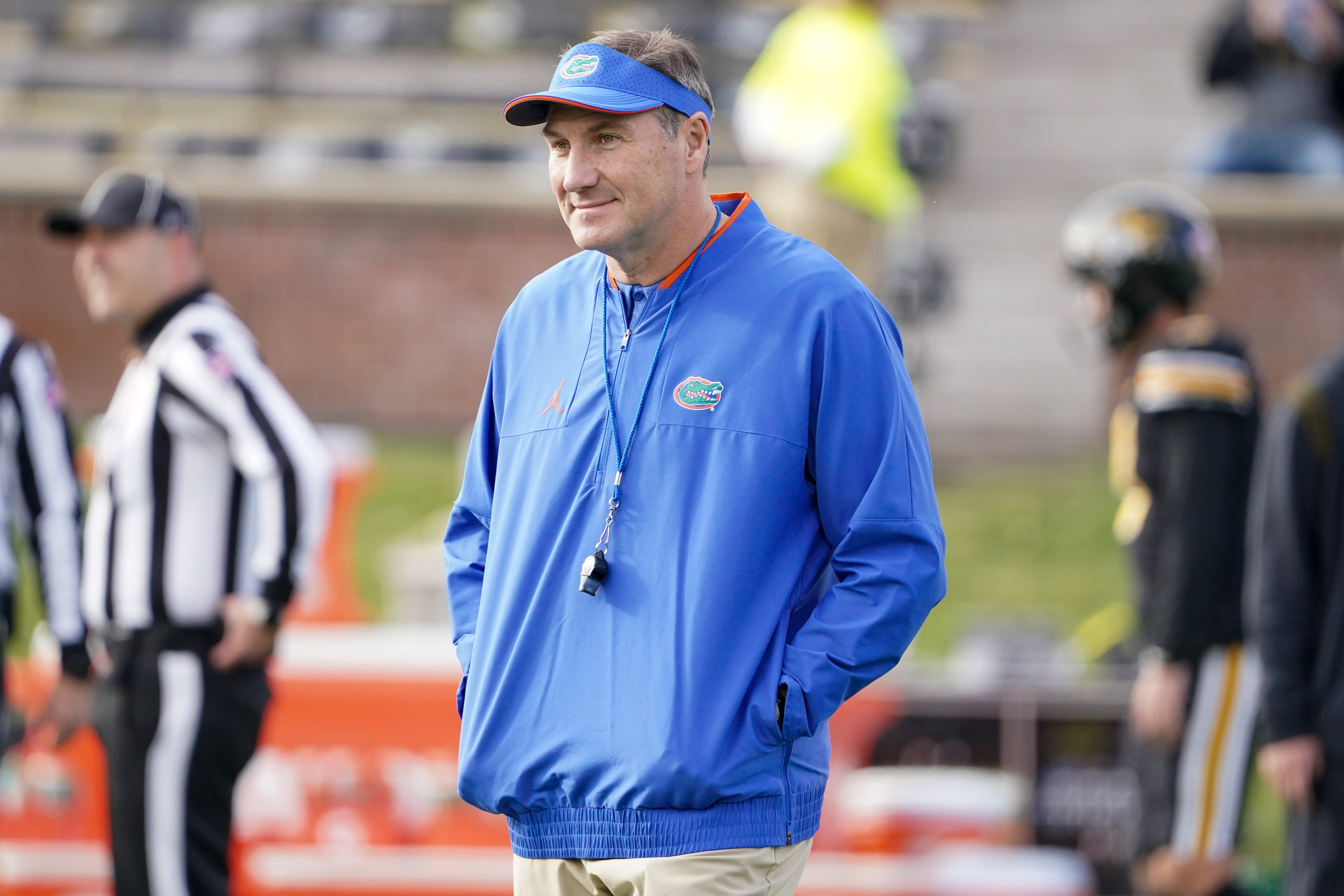 Nov 20, 2021; Columbia, Missouri, USA; Florida Gators head coach Dan Mullen watches team warm ups against the Missouri Tigers before the game at Faurot Field at Memorial Stadium.