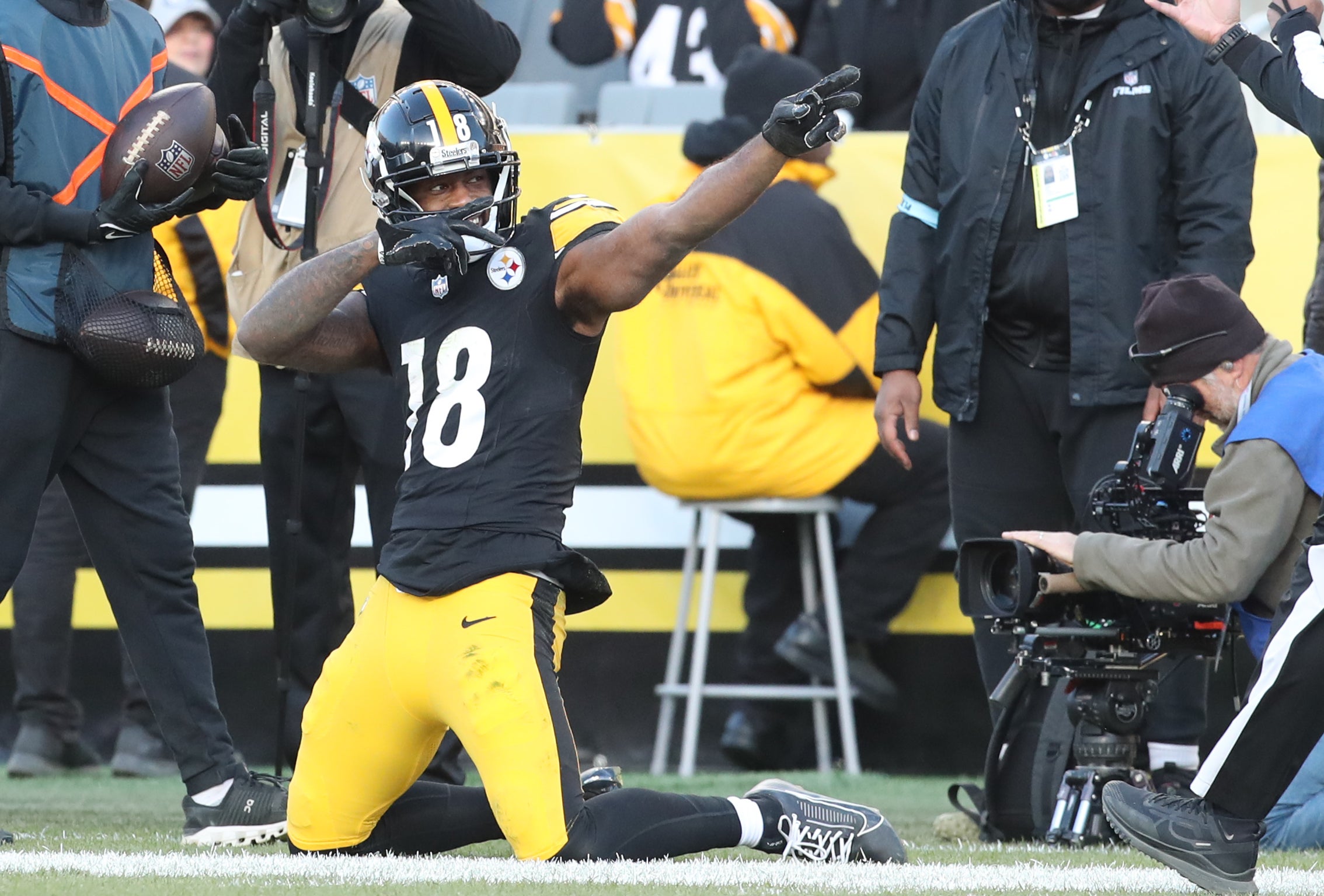 Dec 8, 2024; Pittsburgh, Pennsylvania, USA; Pittsburgh Steelers wide receiver Mike Williams (18) reacts after a first down pass reception against the Cleveland Browns during the third quarter at Acrisure Stadium.