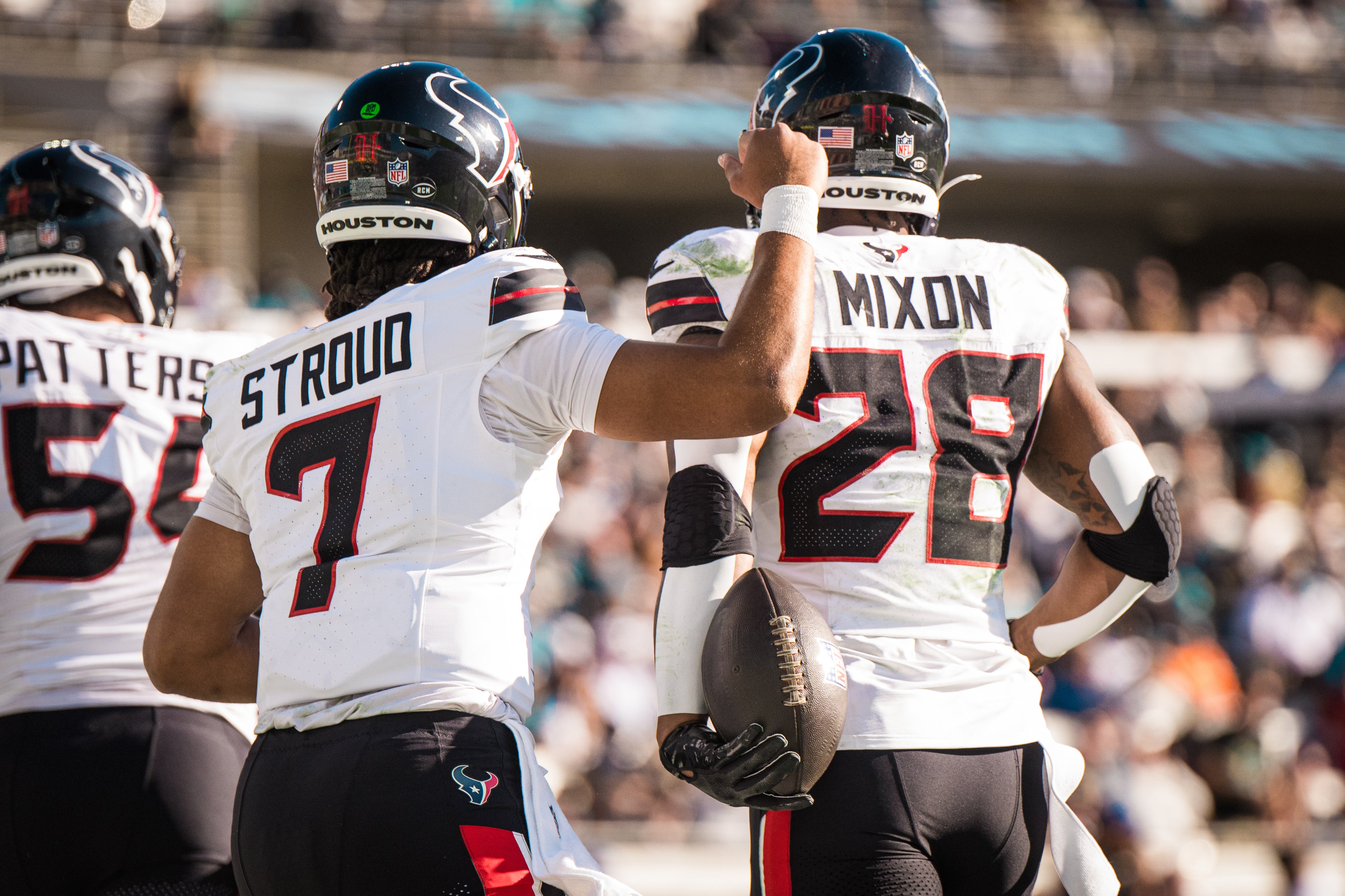 Dec 1, 2024; Jacksonville, Florida, USA; Houston Texans quarterback C.J. Stroud (7) and running back Joe Mixon (28) celebrate a touchdown in the third quarter at EverBank Stadium.