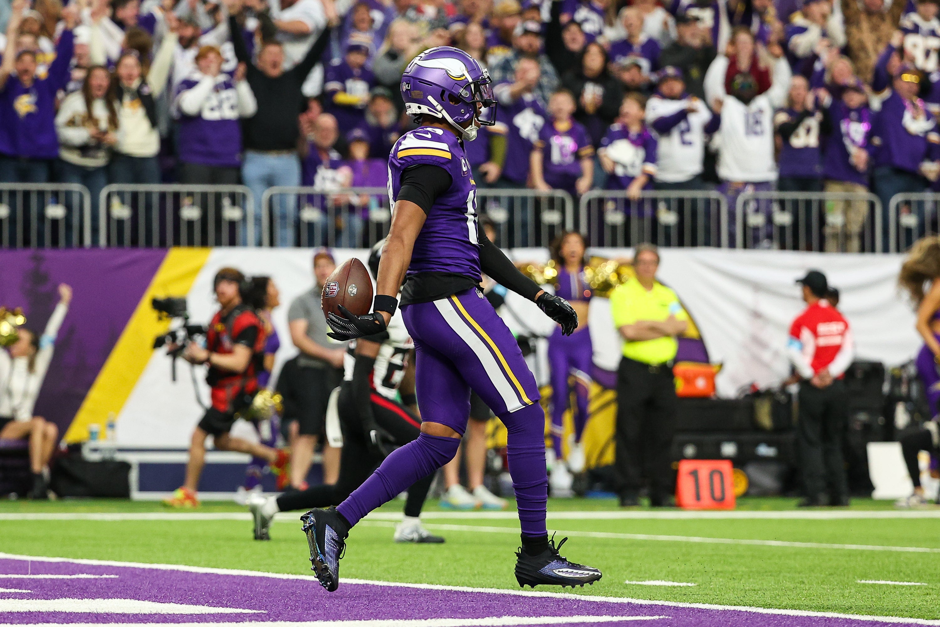 Dec 8, 2024; Minneapolis, Minnesota, USA; Minnesota Vikings wide receiver Justin Jefferson (18) celebrates his touchdown against the Atlanta Falcons during the third quarter at U.S. Bank Stadium.