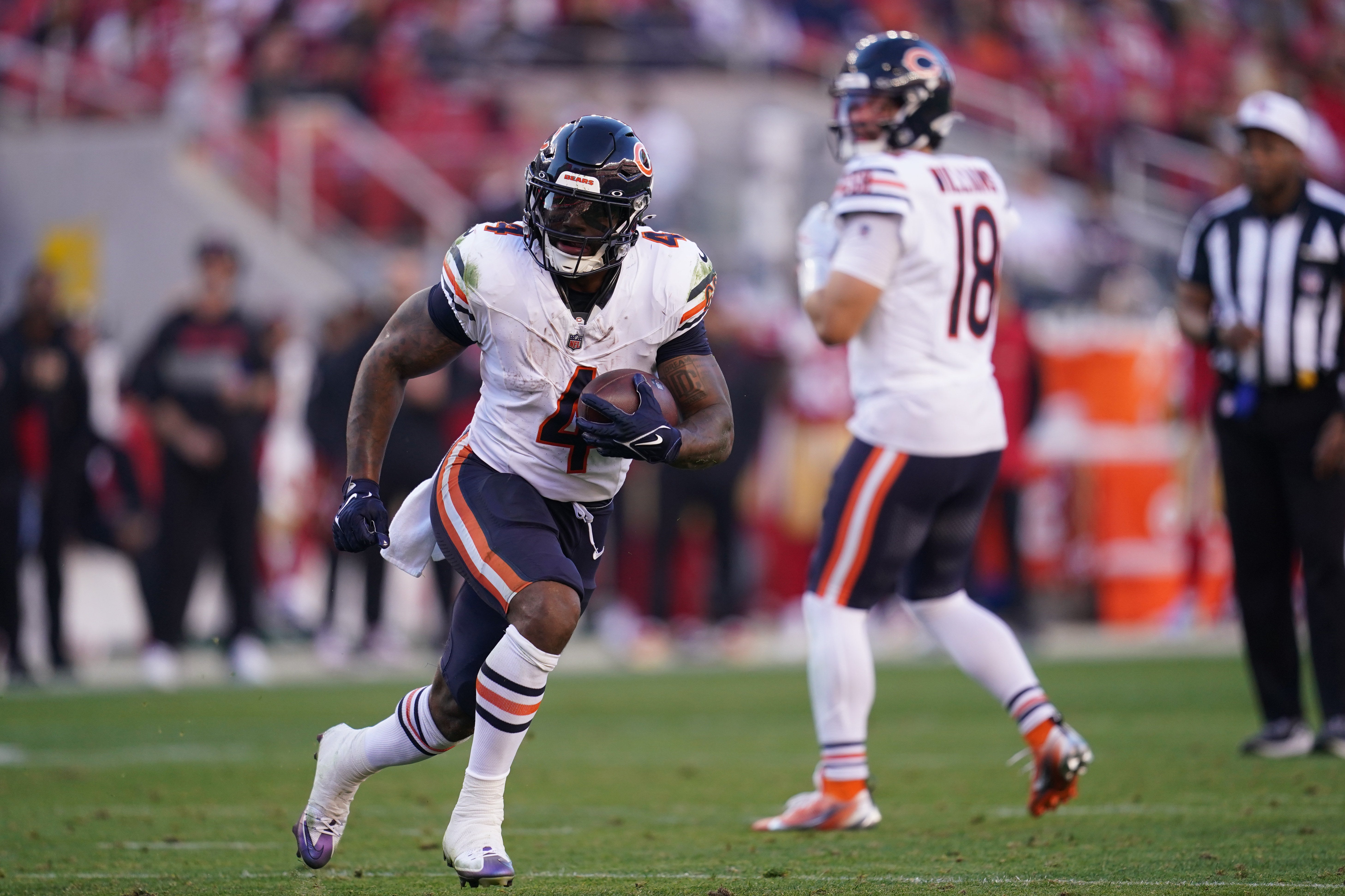 Dec 8, 2024; Santa Clara, California, USA; Chicago Bears running back D'Andre Swift (4) runs the ball against the San Francisco 49ers in the third quarter at Levi's Stadium.