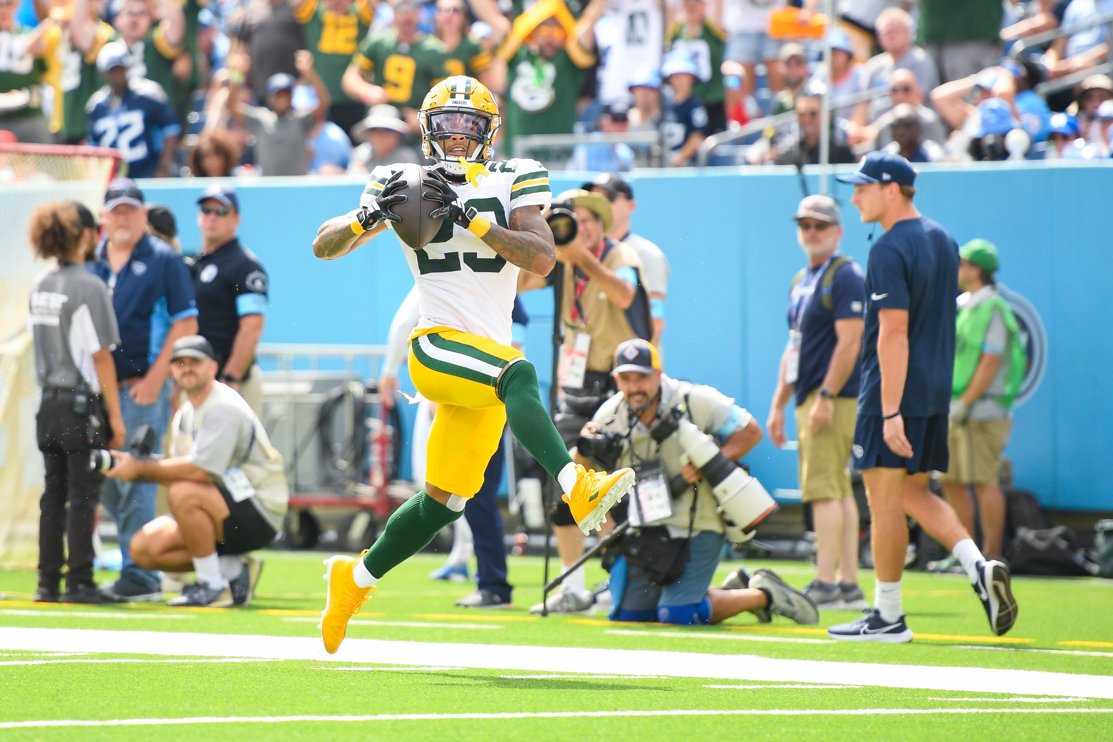 Green Bay Packers cornerback Jaire Alexander (23) scores on a pick six thrown by Tennessee Titans Will Levis (8) during the first half at Nissan Stadium.