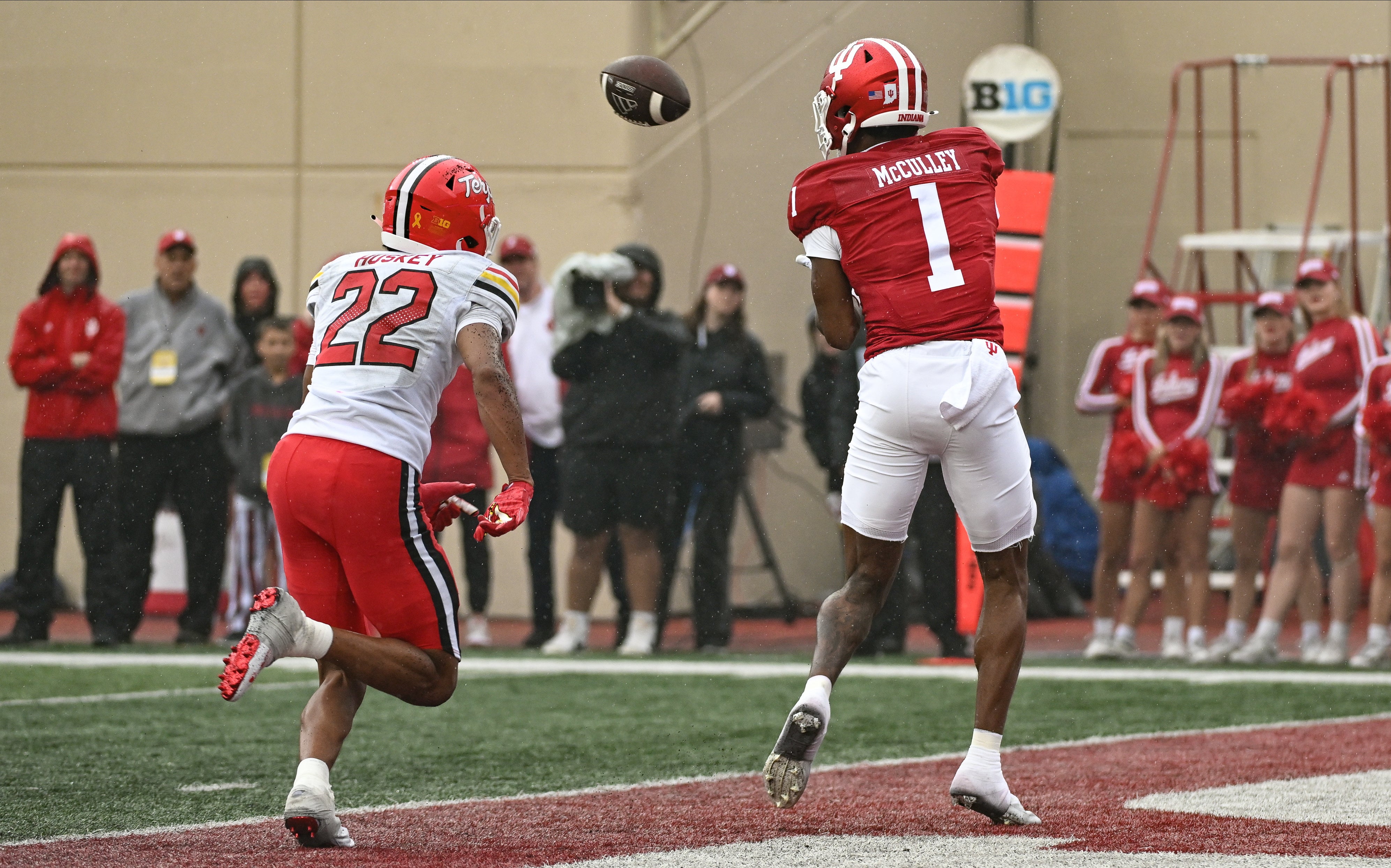 Sep 28, 2024; Bloomington, Indiana, USA; Indiana Hoosiers wide receiver Donaven McCulley (1) catches a pass for a touchdown against Maryland Terrapins defensive back Jalen Huskey (22) during the second half at Memorial Stadium.