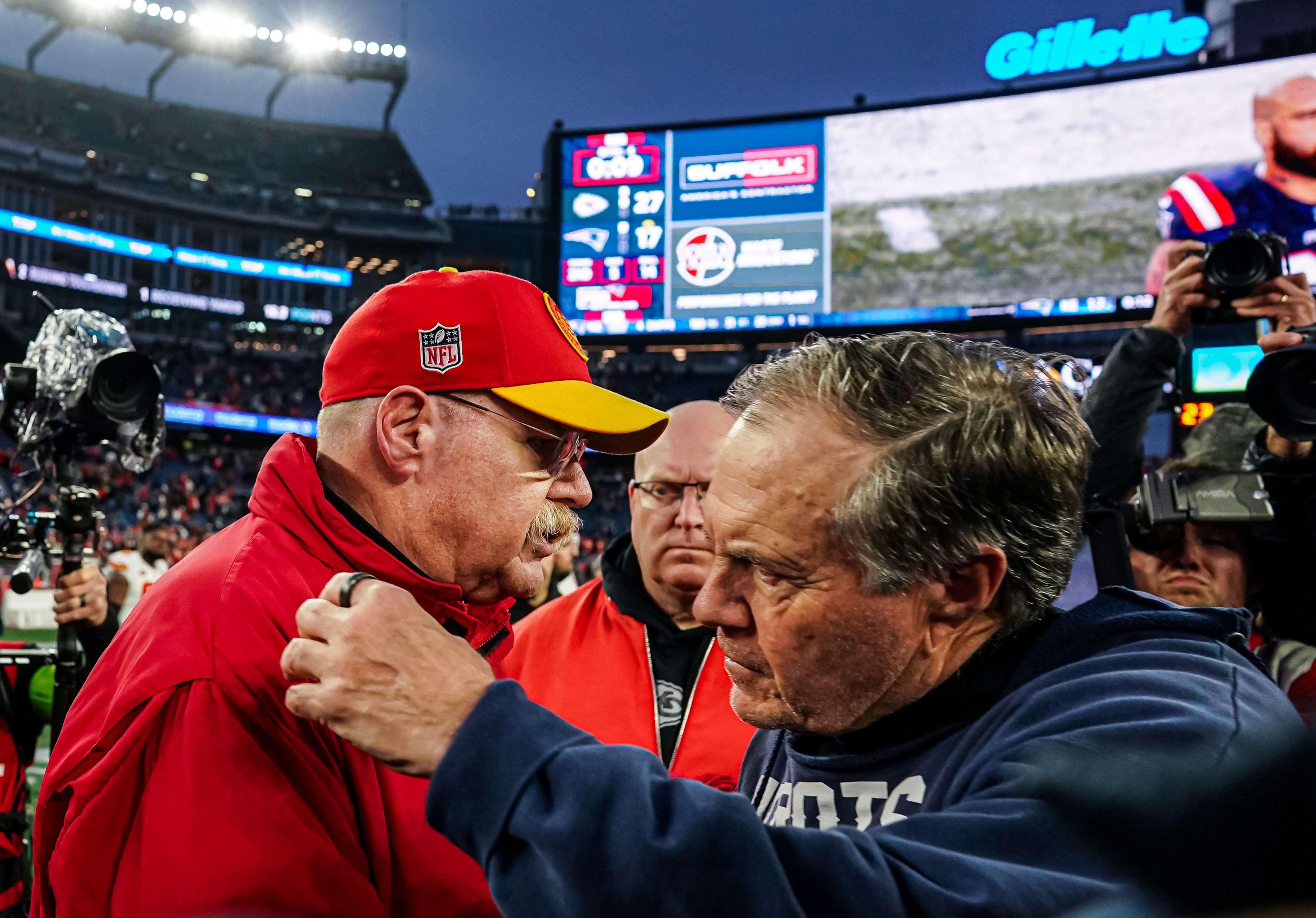 Dec 17, 2023; Foxborough, Massachusetts, USA; New England Patriots head coach Bill Belichick and Kansas City Chiefs head coach Andy Reid meet on the field after the game at Gillette Stadium.