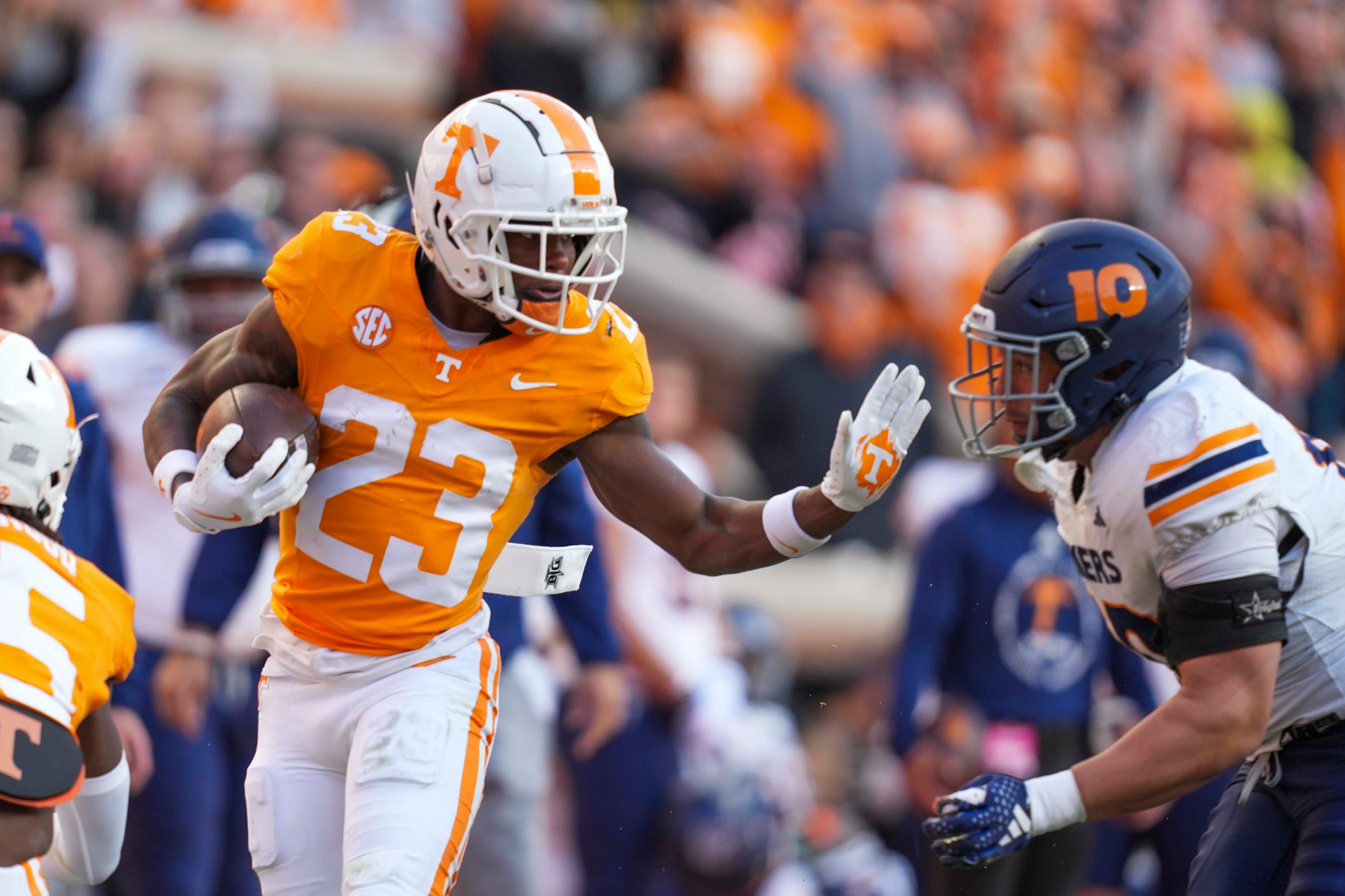 Tennessee running back Cameron Seldon (23) puts his hand up to stop UTEP defensive lineman Hunter Rapolla (10) during a NCAA football game between Tennessee and UTEP in Neyland Stadium on Saturday, November 23, 2024.