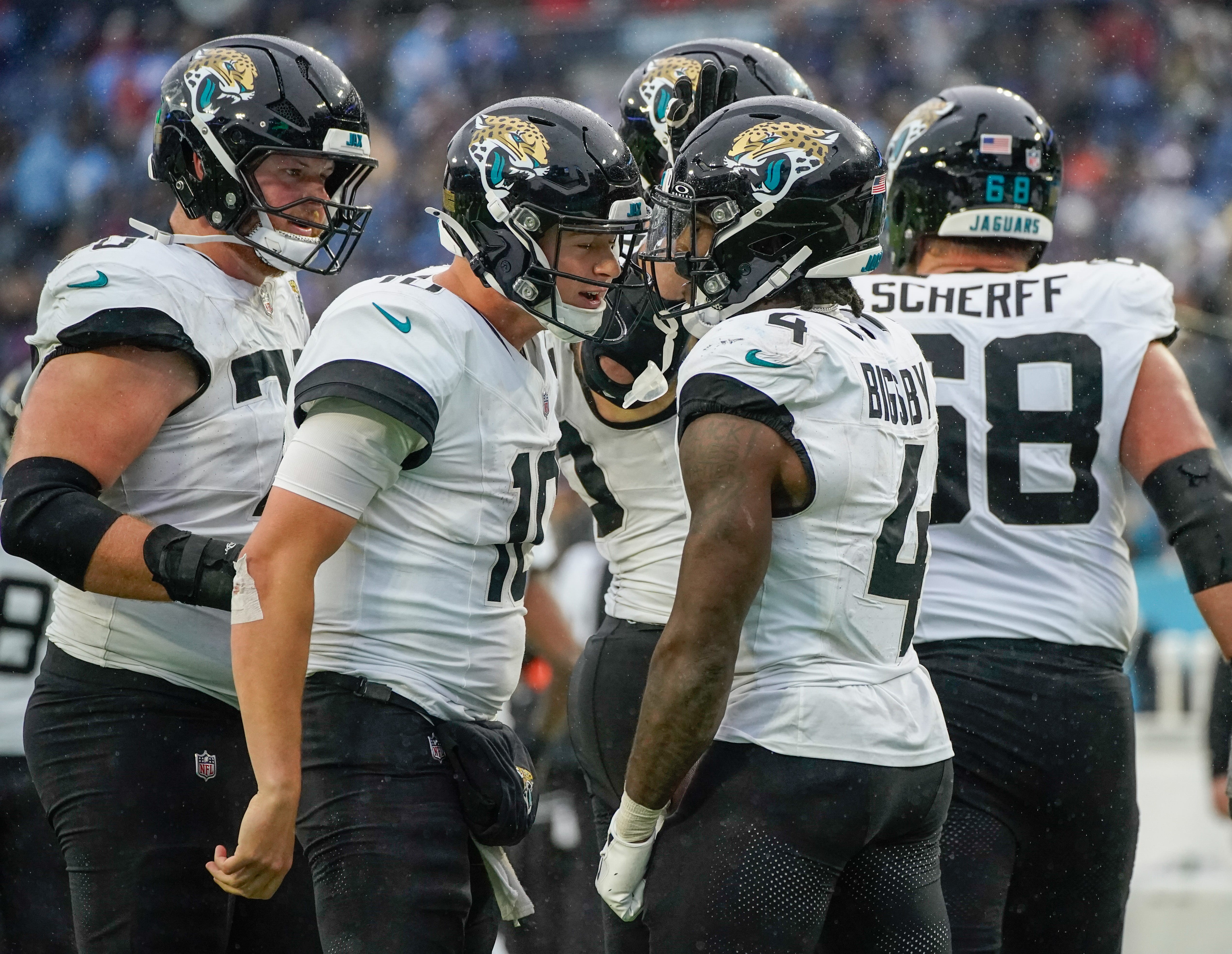 Jacksonville Jaguars quarterback Mac Jones (10) celebrates with running back Tank Bigsby (4) after Bigsby ran in a touchdown in the fourth quarter at Nissan Stadium in Nashville, Tenn., Sunday, Dec. 8, 2024.