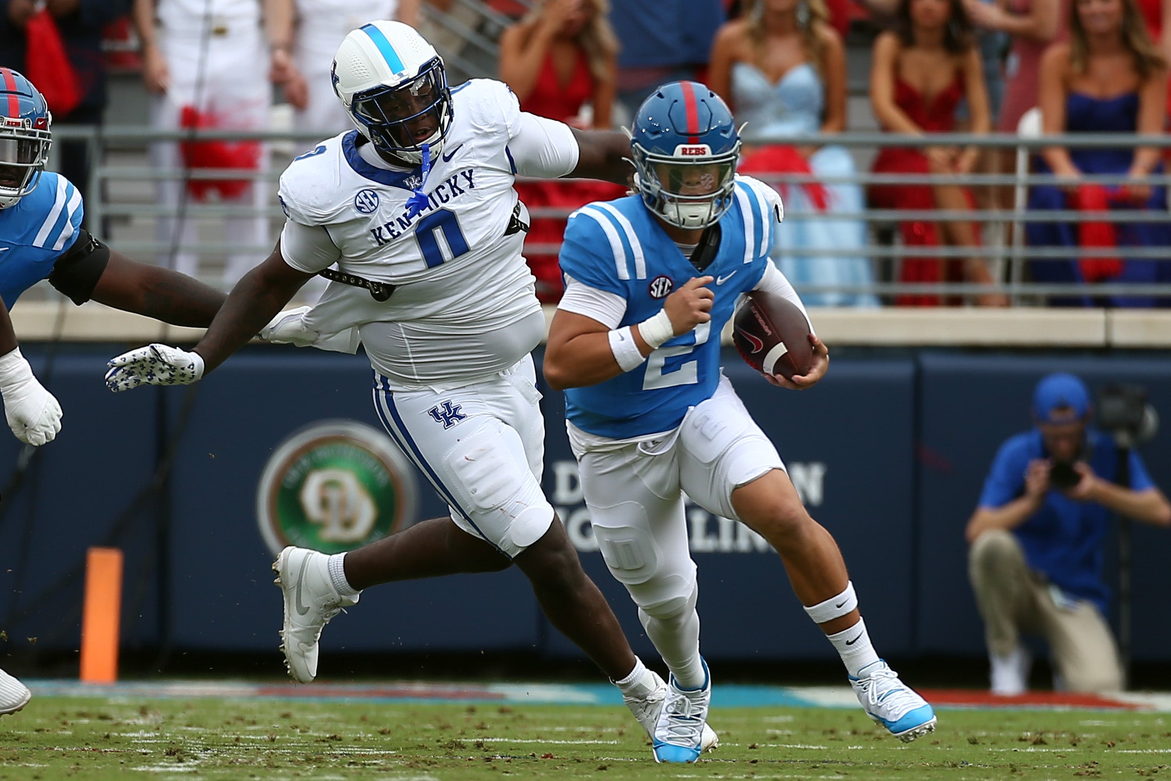 Sep 28, 2024; Oxford, Mississippi, USA; Mississippi Rebels quarterback Jaxson Dart (2) runs the ball as Kentucky Wildcats defensive linemen Deone Walker (0) pursues during the first half at Vaught-Hemingway Stadium.
