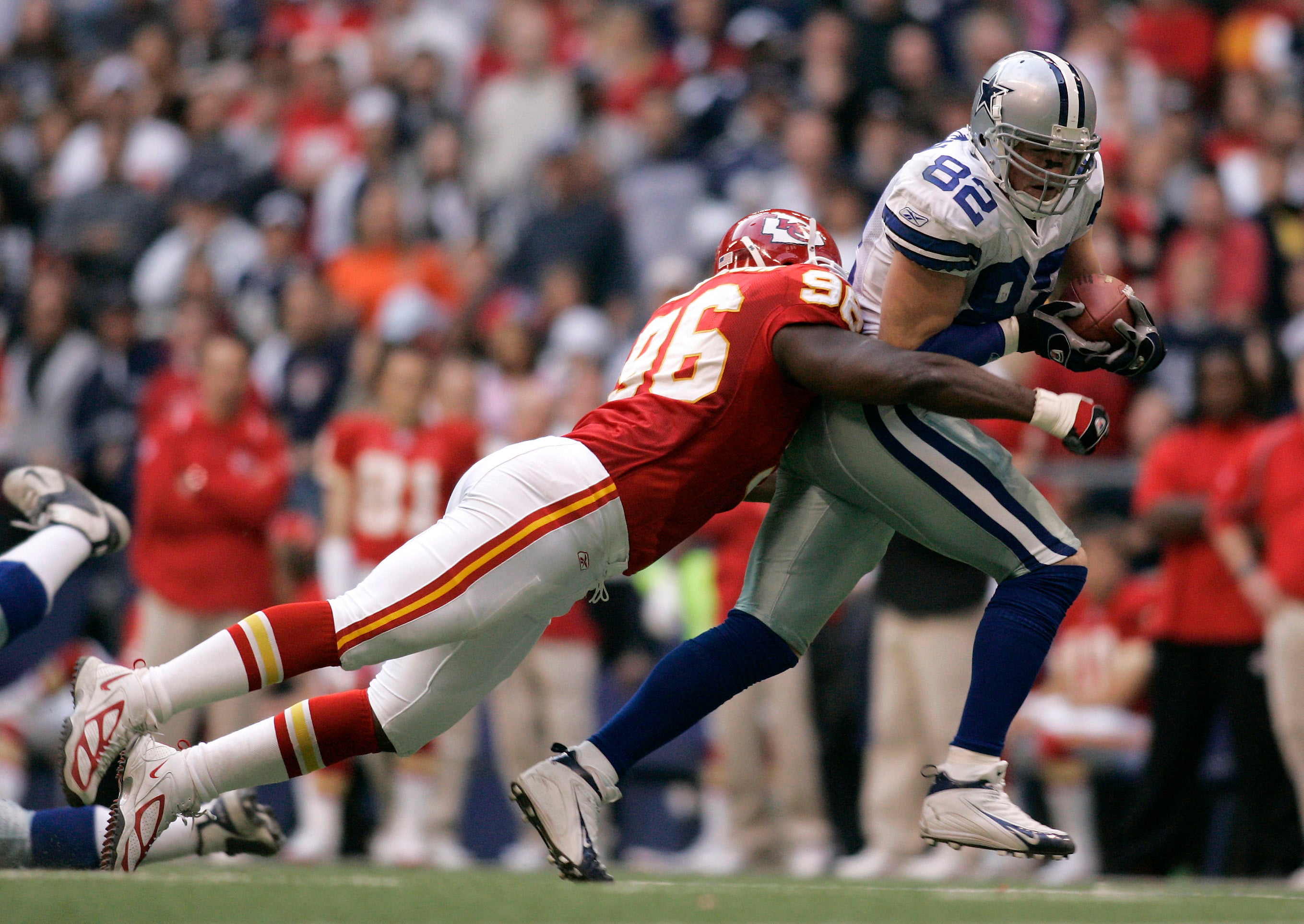 Dec. 11, 2005; Irving, Texas USA; Dallas Cowboys tight end (82) Jason Witten is tackled by Kansas City Chiefs tackle (96) Jimmy Wilkerson during the 2nd quarter against the Kansas City Chiefs at Texas Stadium.