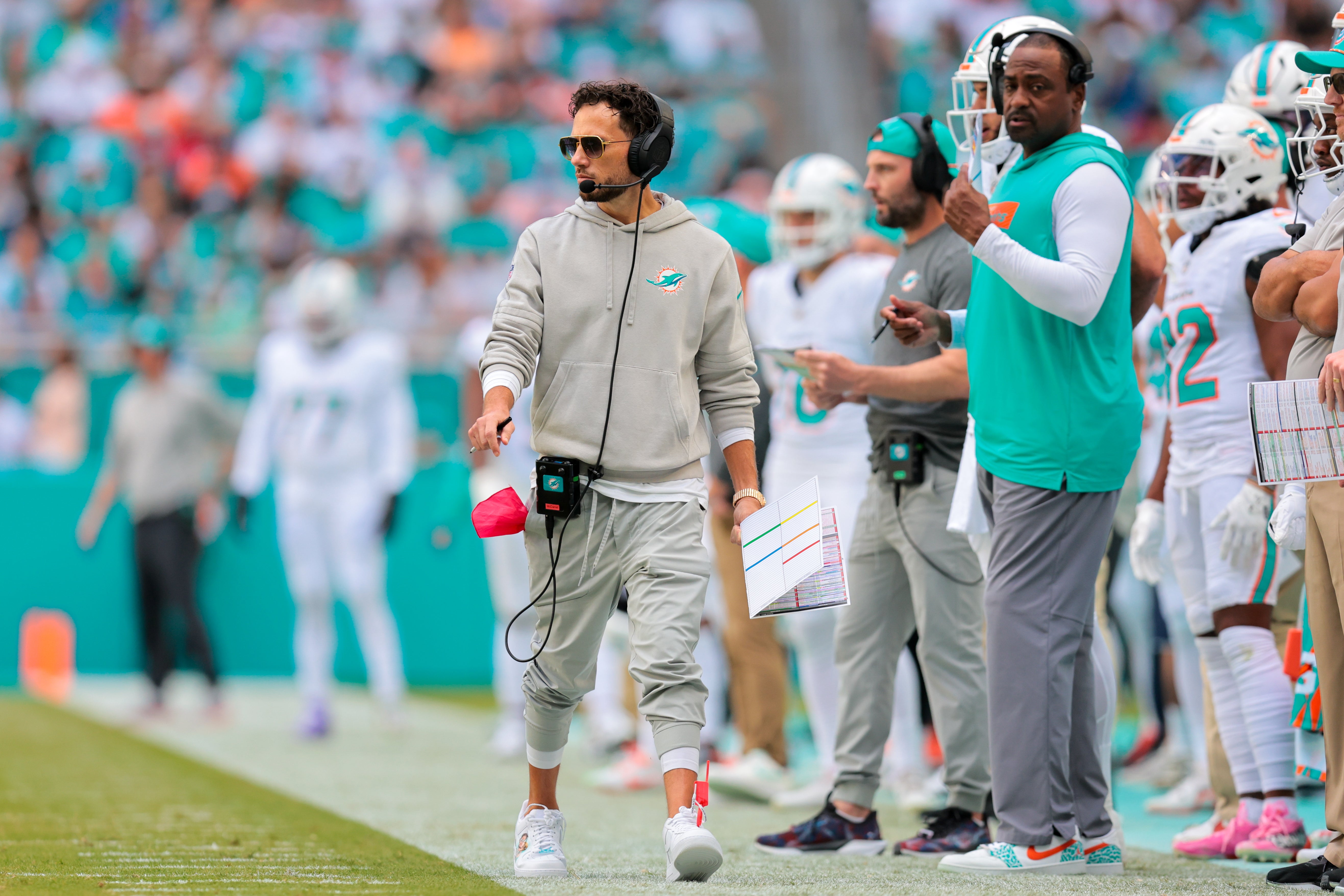 Dec 8, 2024; Miami Gardens, Florida, USA; Miami Dolphins head coach Mike McDaniel watches from the sideline against the New York Jets during the second quarter at Hard Rock Stadium.