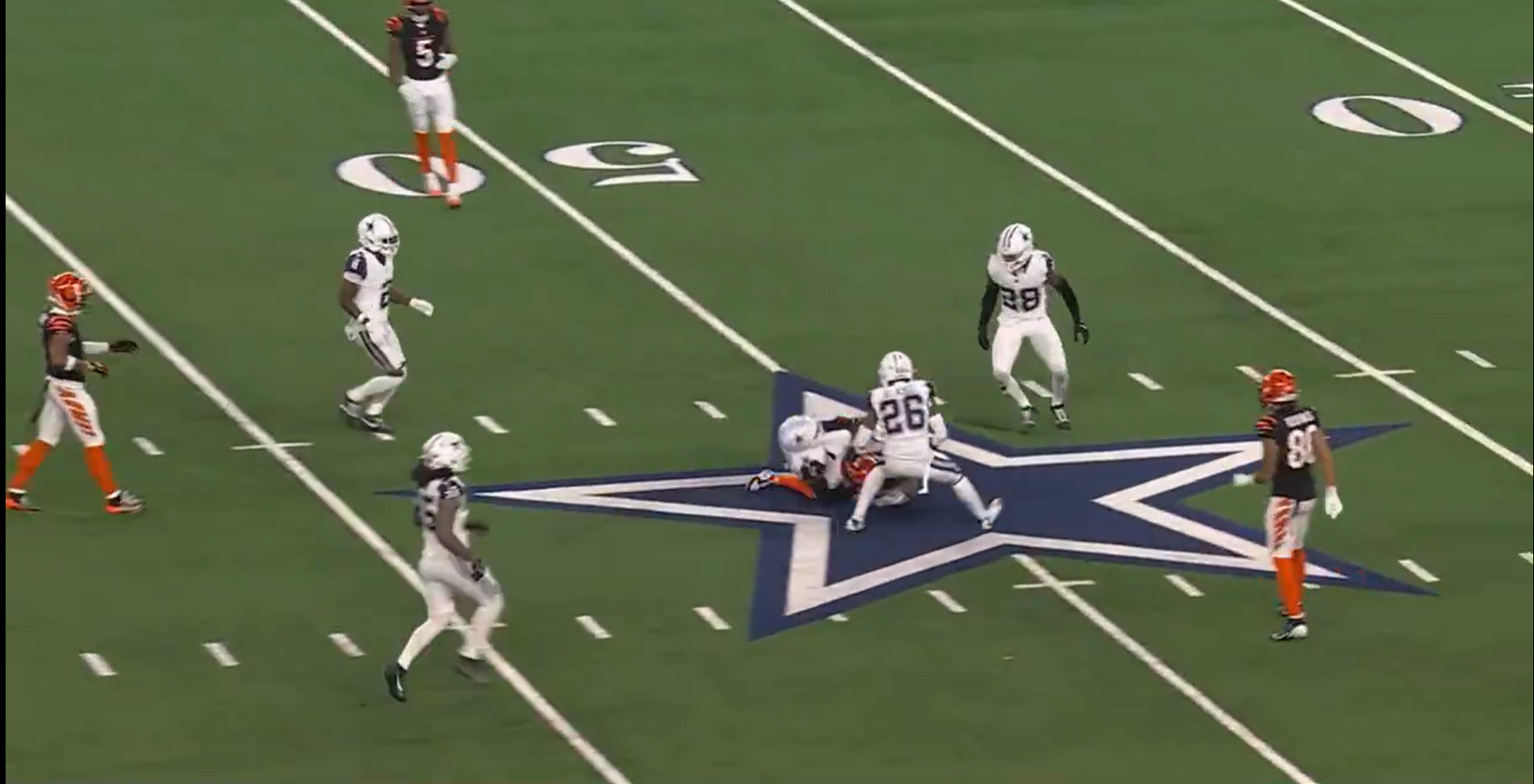 Dallas Cowboys safety Donovan Wilson tackles Bengals TE Tanner Hudson.