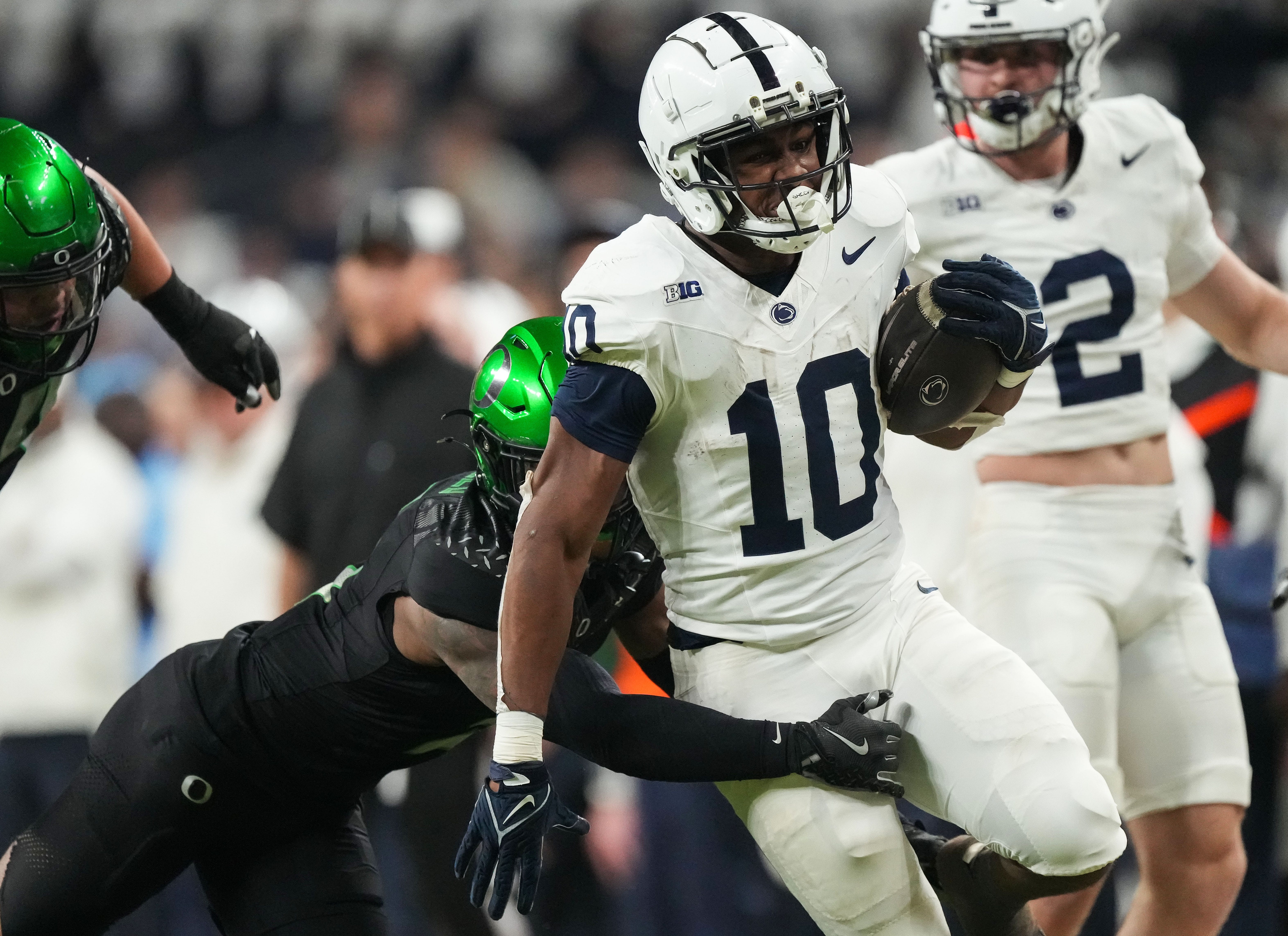 Penn State Nittany Lions running back Nicholas Singleton (10) rushes up the field Saturday, Dec. 7, 2024, during the Big Ten Championship game at Lucas Oil Stadium in Indianapolis.