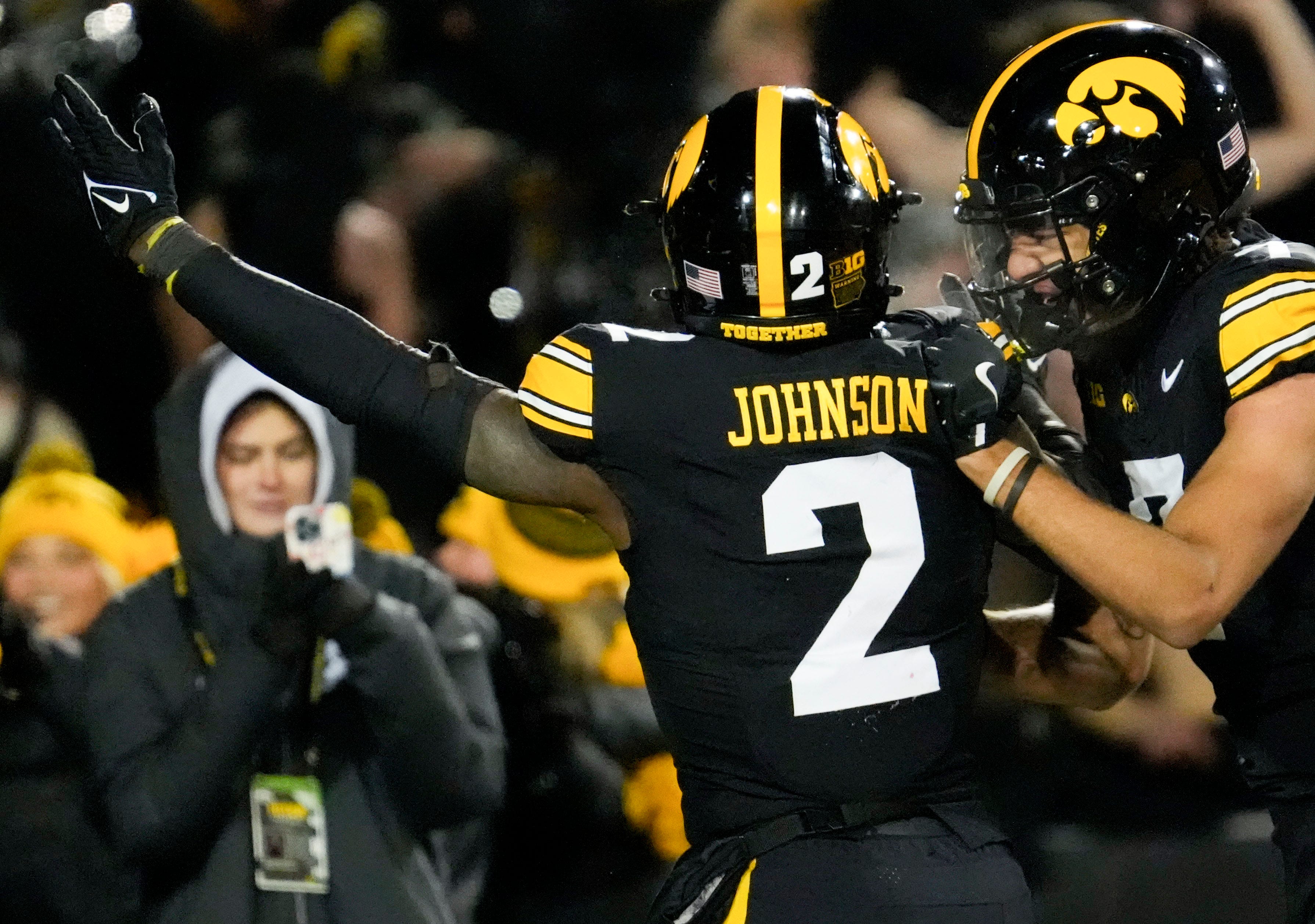 Iowa Hawkeyes running back Kaleb Johnson (2) celebrates his touchdown against the Nebraska Cornhuskers with teammate Dayton Howard (7) Friday, Nov. 29, 2024 at Kinnick Stadium in Iowa City, Iowa.