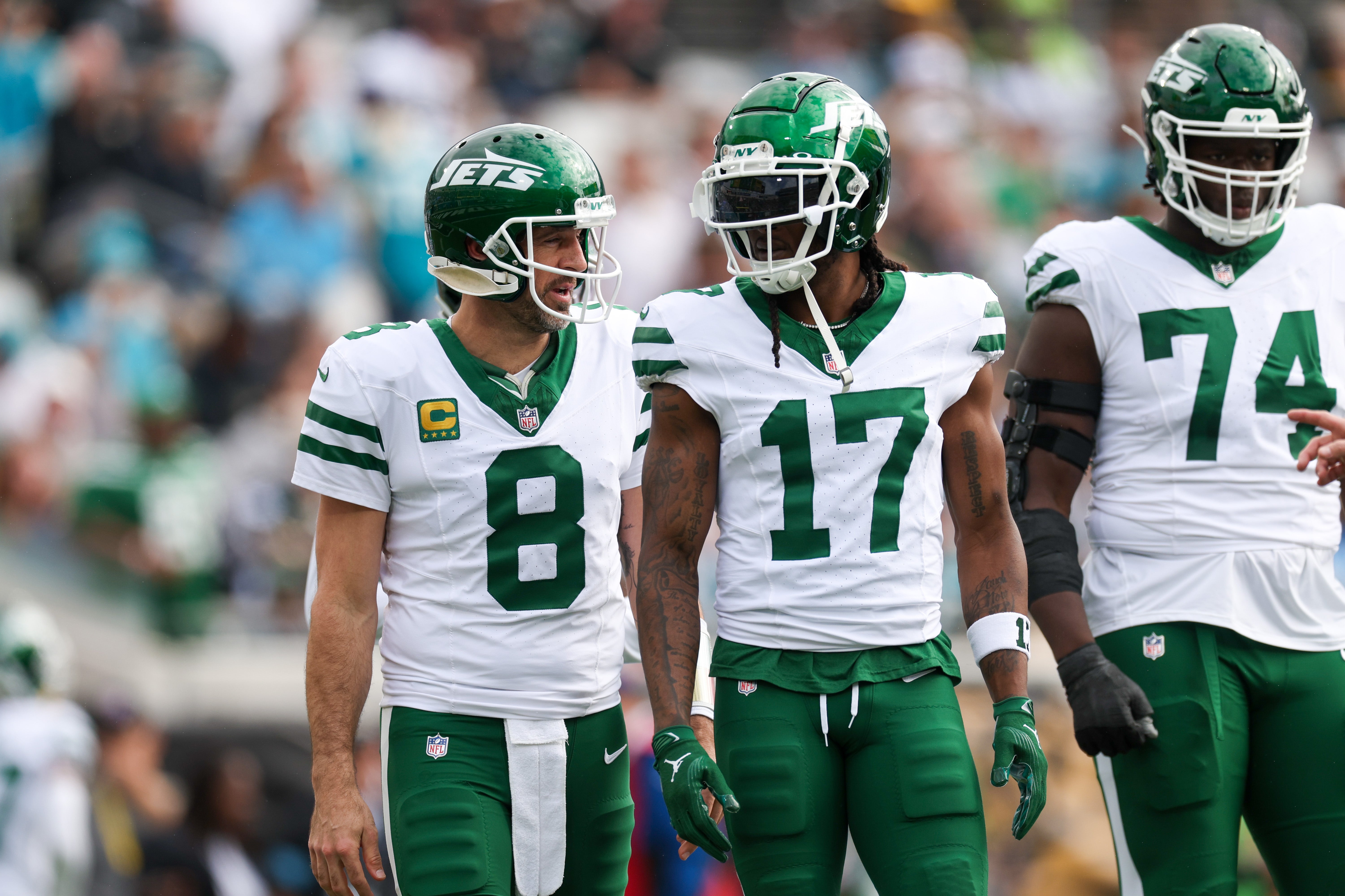 New York Jets quarterback Aaron Rodgers (8) and wide receiver Davante Adams (17) was out to the field after a turnover against the Jacksonville Jaguars in the first quarter at EverBank Stadium.