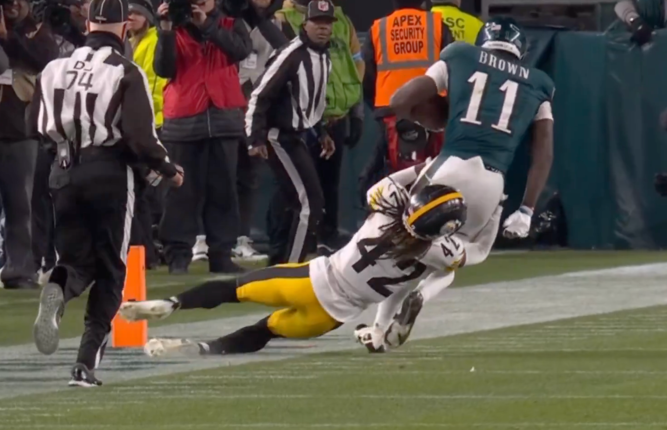Eagles WR AJ Brown is tackled by Steelers cornerback James Pierre Week 15