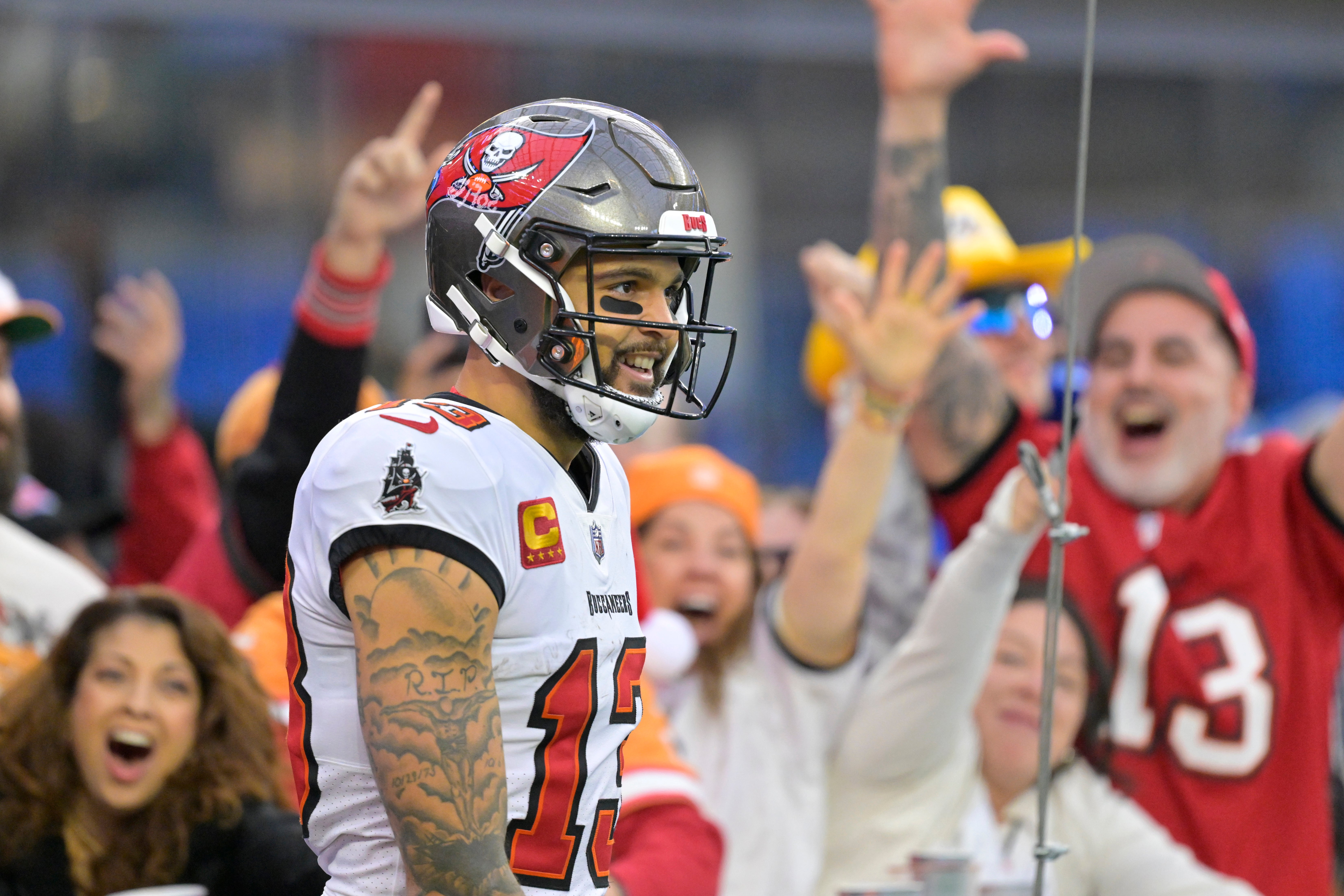 Dec 15, 2024; Inglewood, California, USA; Fans celebrate after a touchdown by Tampa Bay Buccaneers wide receiver Mike Evans (13) in the second half against the Los Angeles Chargers at SoFi Stadium.