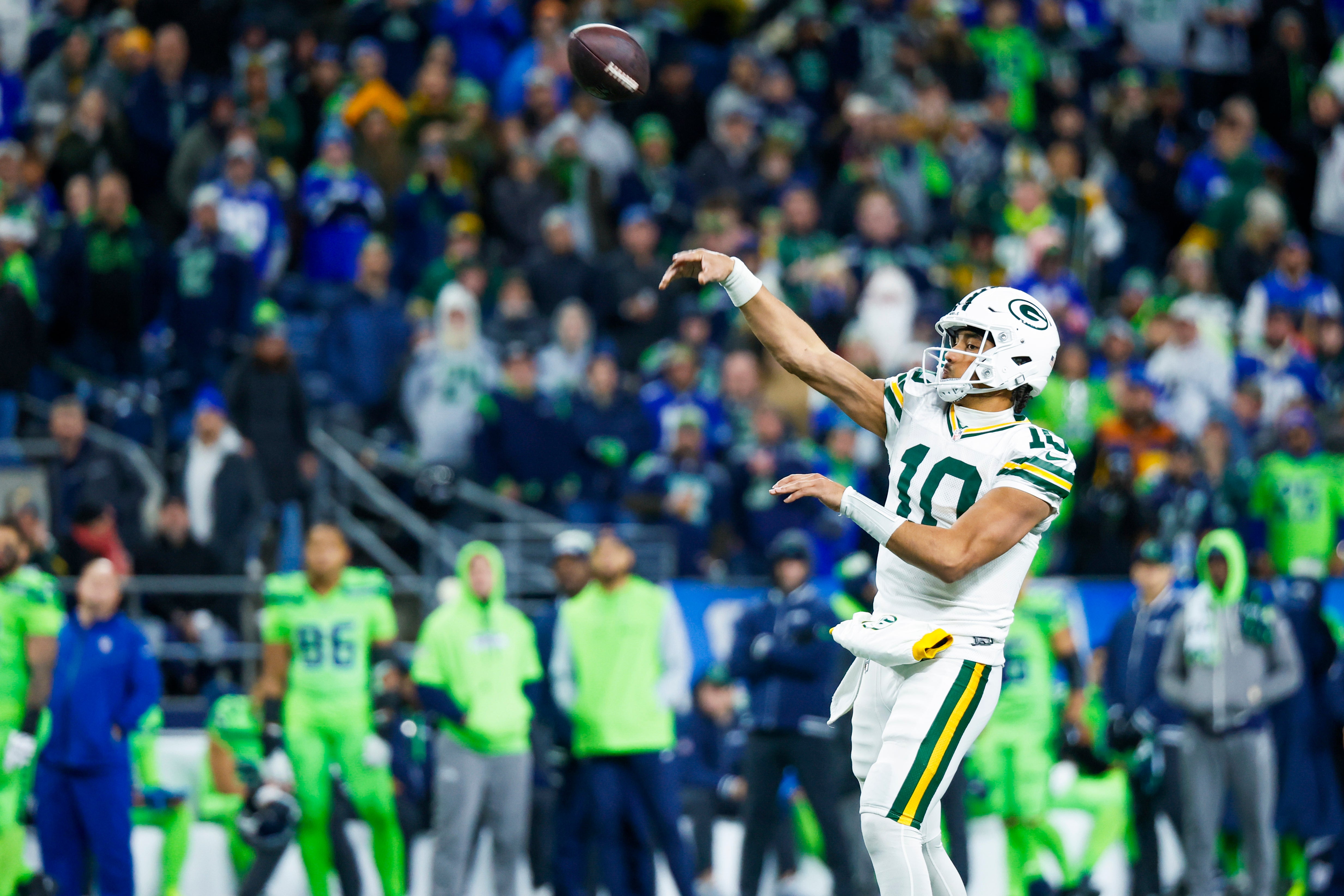 Green Bay Packers quarterback Jordan Love (10) throws a touchdown pass against the Seattle Seahawks during the fourth quarter at Lumen Field.
