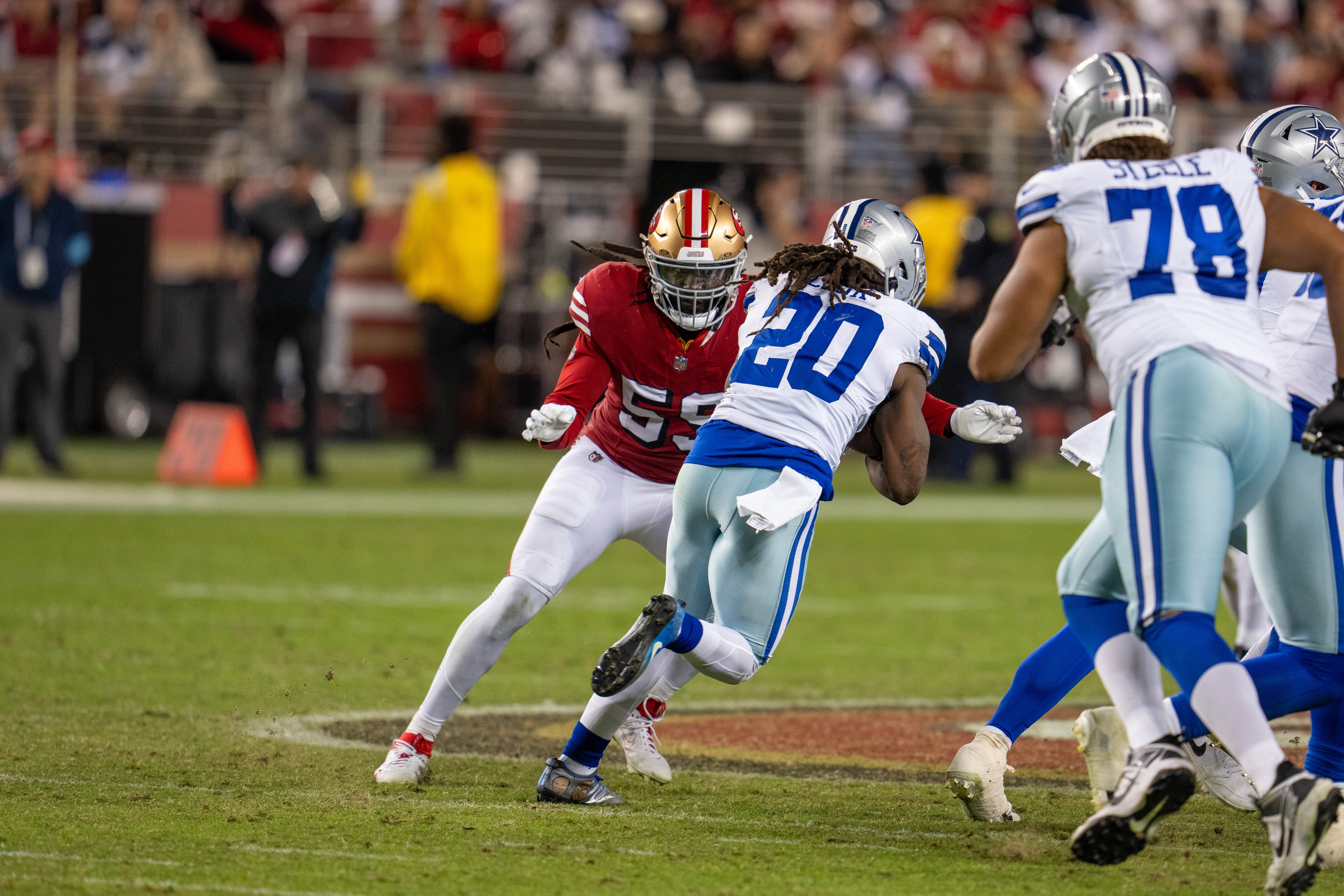 Dallas Cowboys running back Dalvin Cook (20) is tackled by San Francisco 49ers linebacker De'Vondre Campbell (59) during the third quarter at Levi's Stadium.