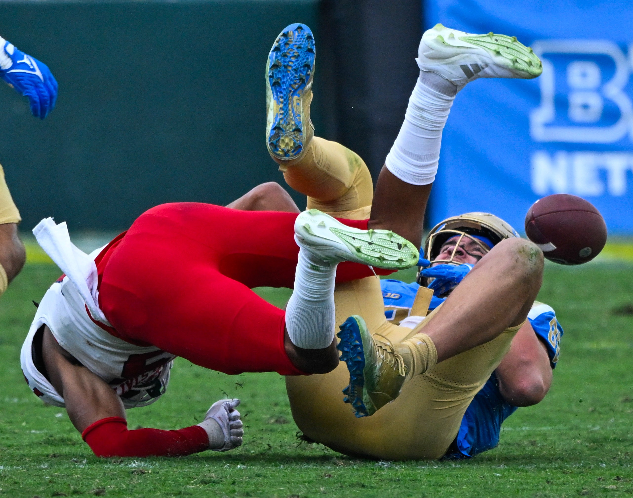  Fresno State Bulldogs defensive back Julian Neal (15) tackles UCLA Bruins tight end Moliki Matavao (88) causing a fumble during the third quarter at Rose Bowl. 